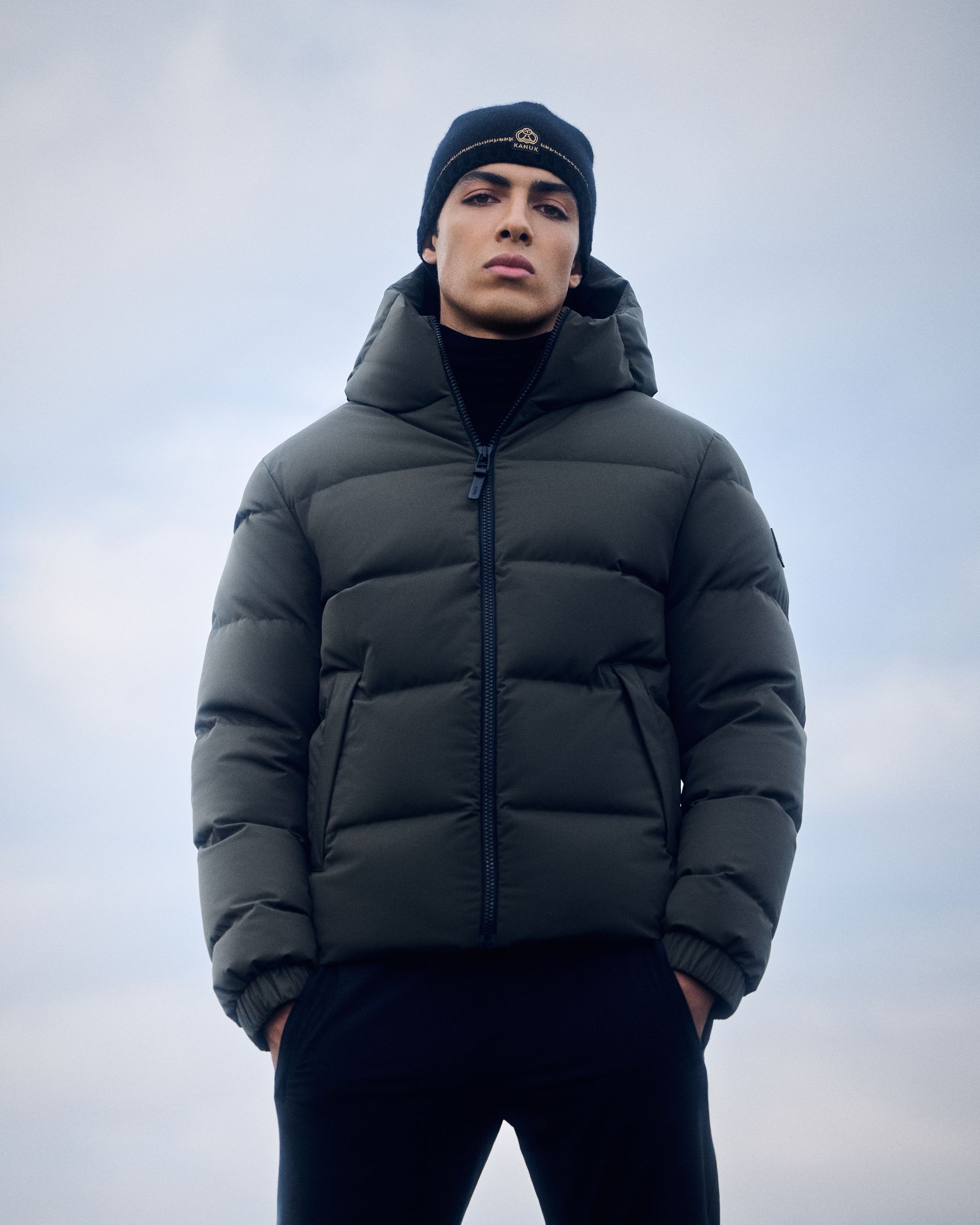 a man wearing a black puffer jacket