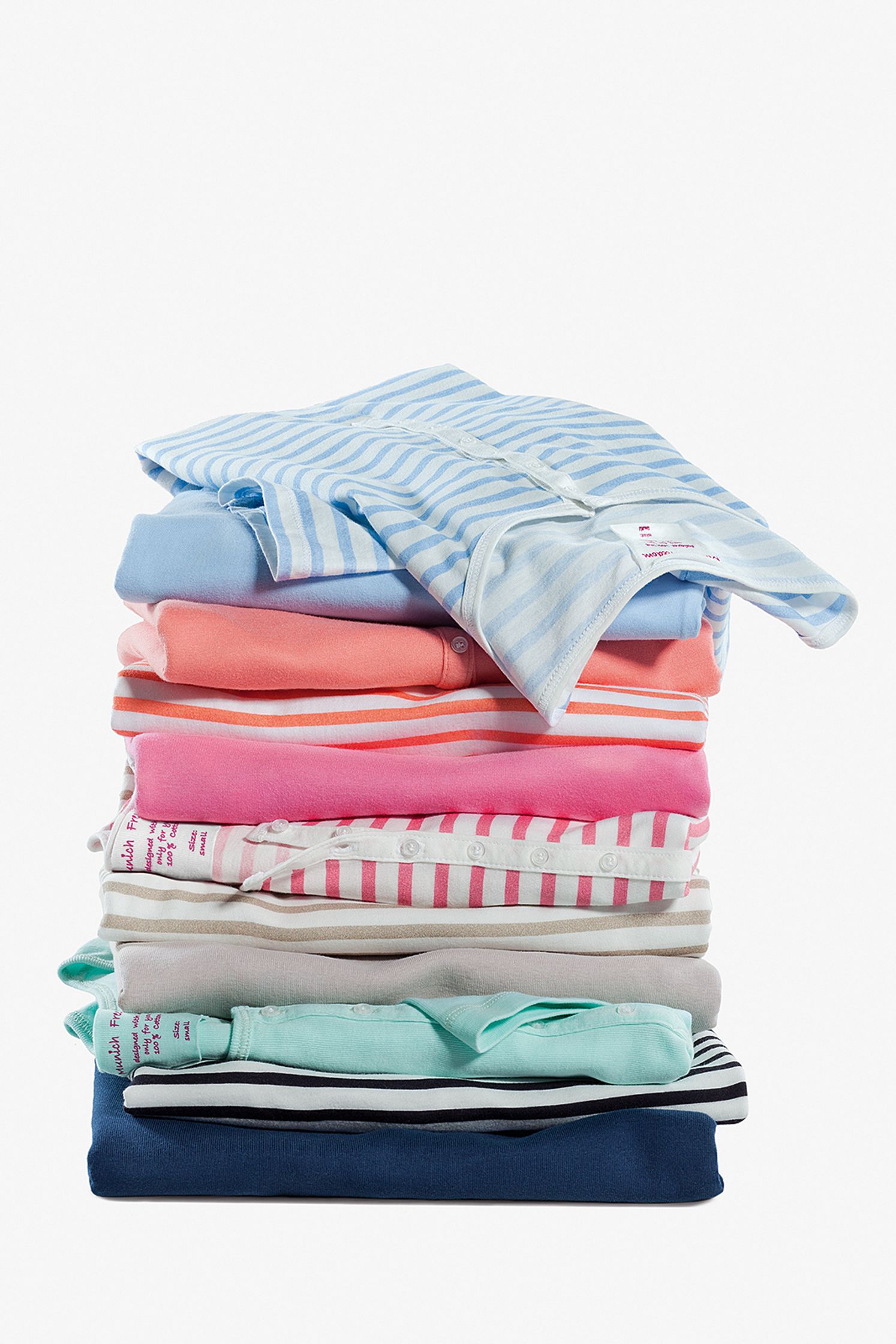 a stack of striped shirts on a white background Post Production Hamburg