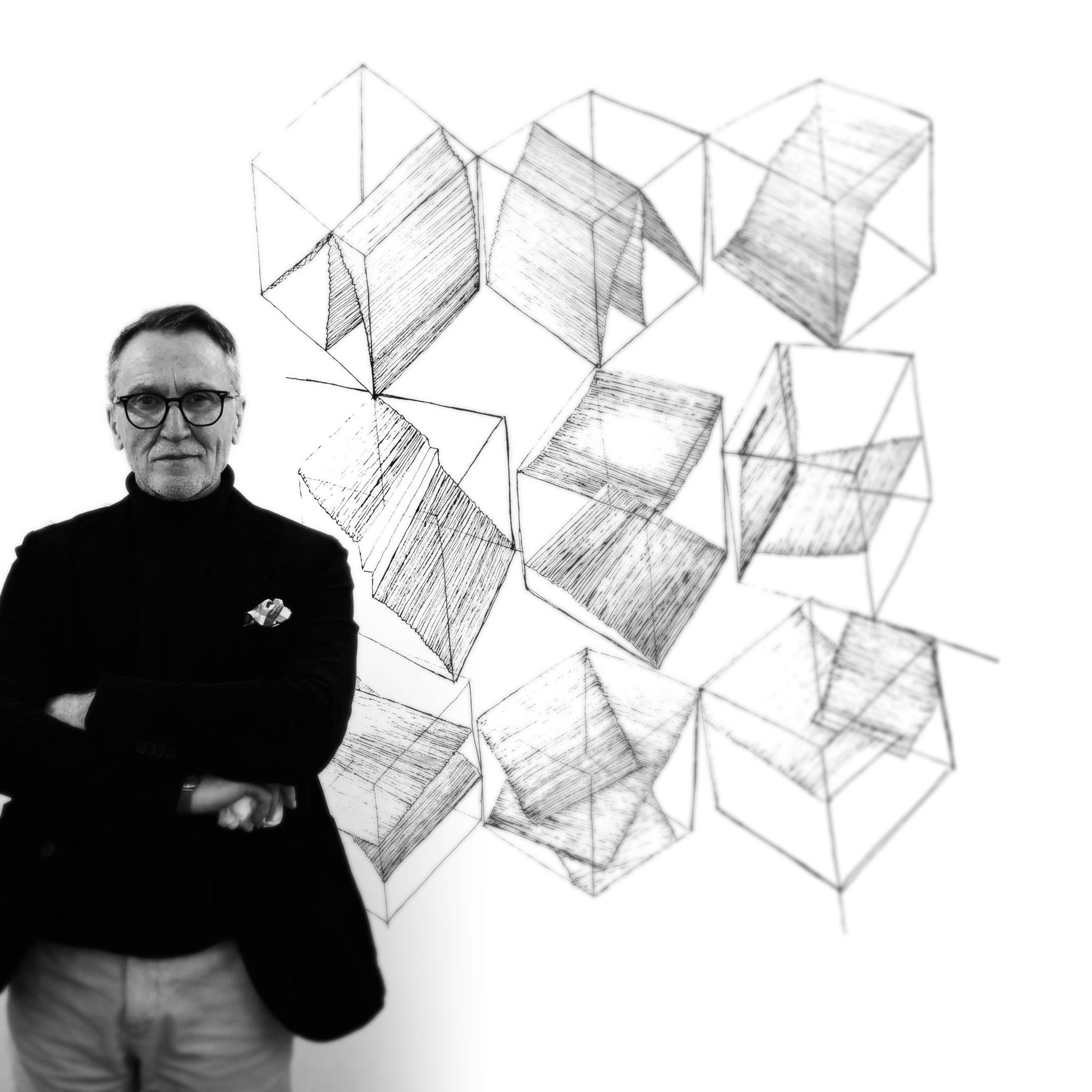 a man standing in front of a drawing of cubes