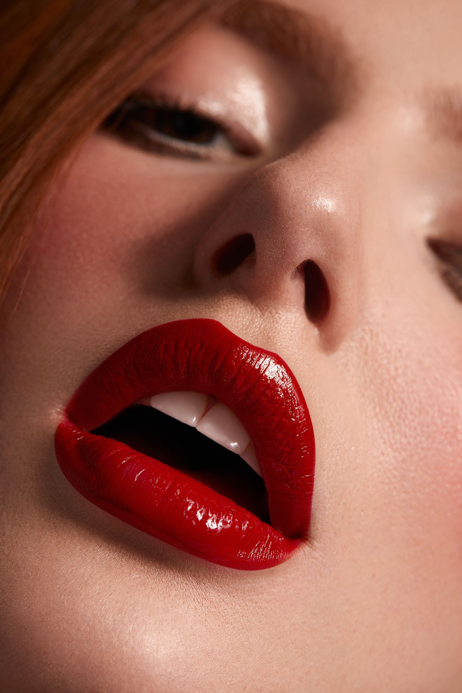 a close up of a woman with red lips