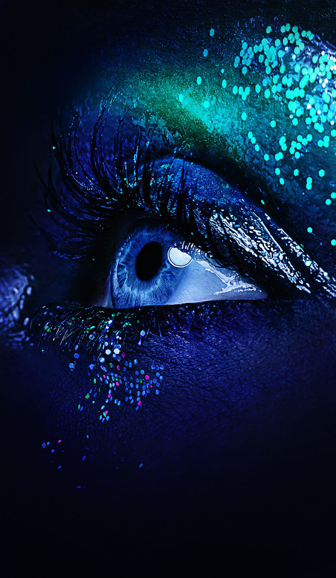 an image of a woman's eye with blue glitter post production