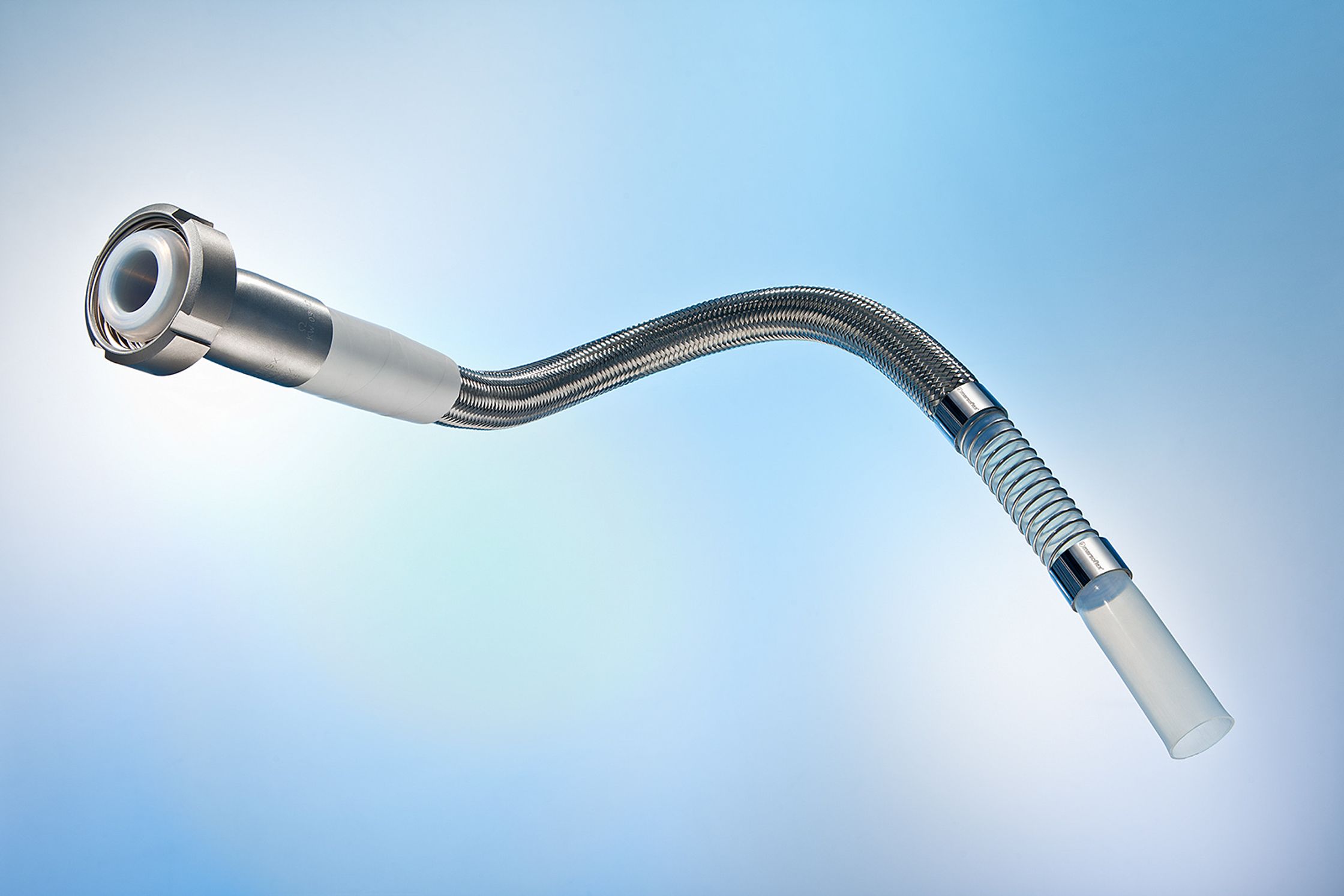 a medical device with a curved hose on a blue background Bildbearbeitung Hamburg