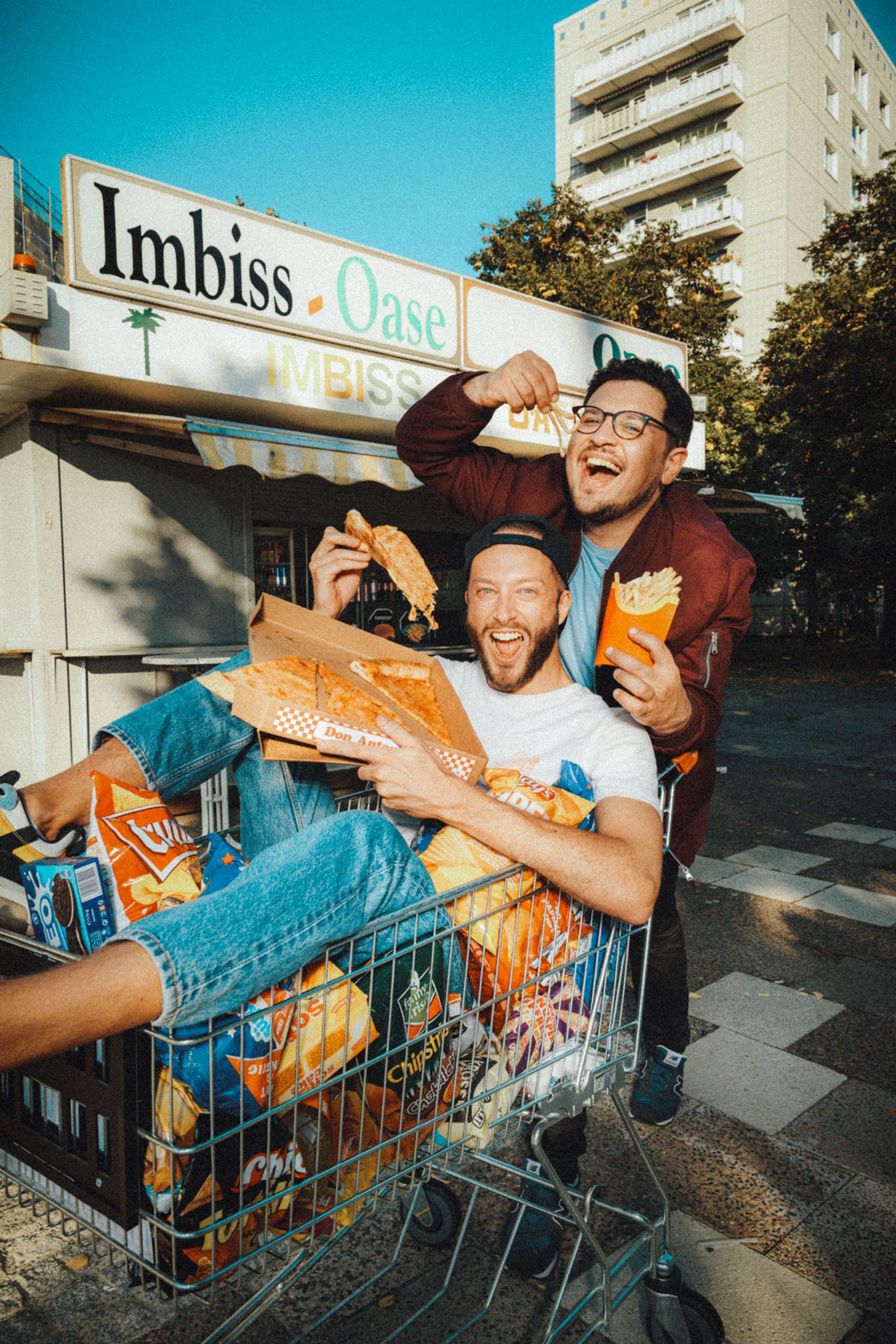 two men in a shopping cart