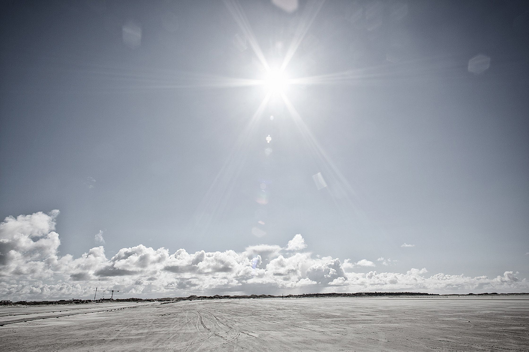 the sun is shining over a sandy beach post production image campaign