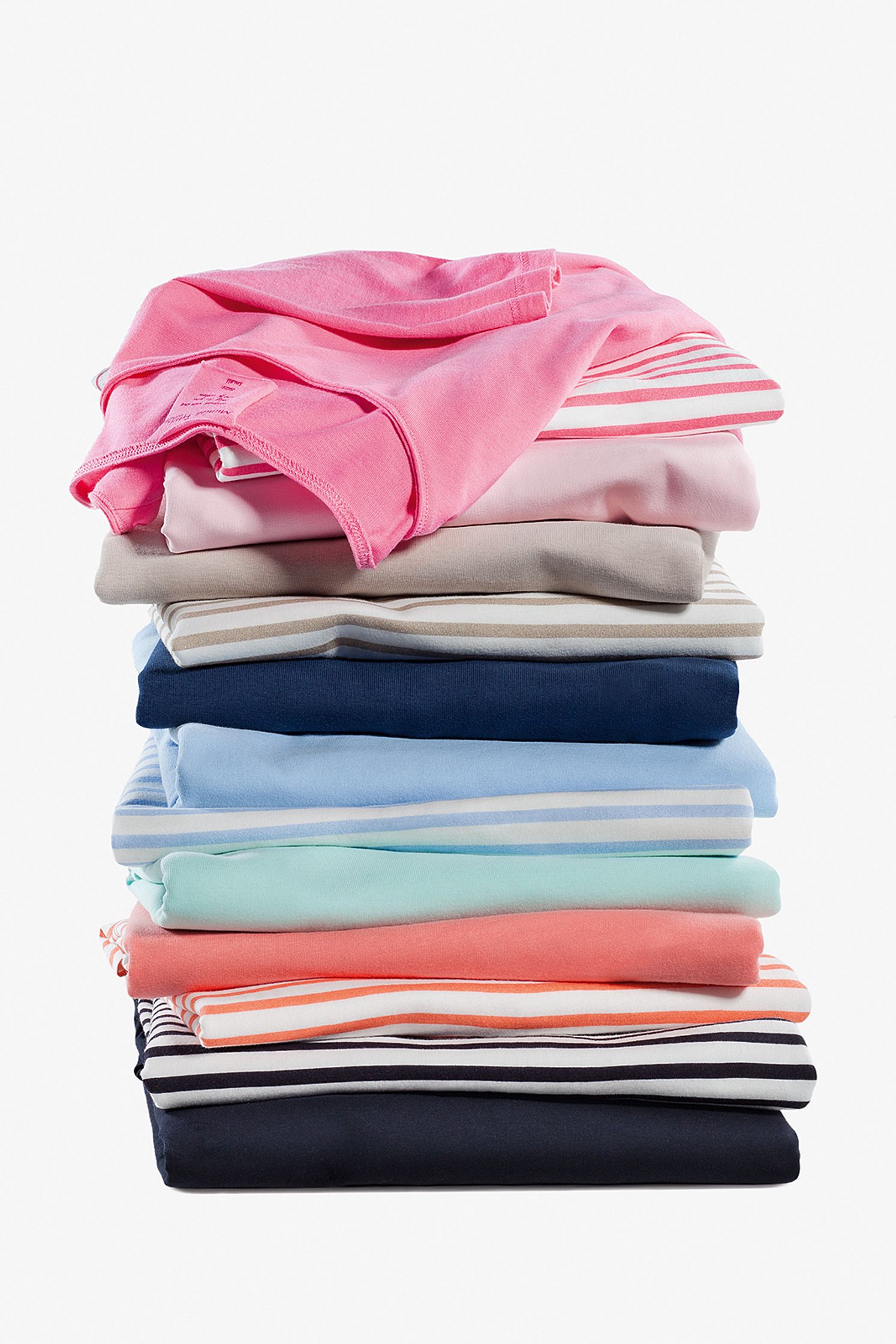 a stack of colorful shirts on a white background Post Production Hamburg