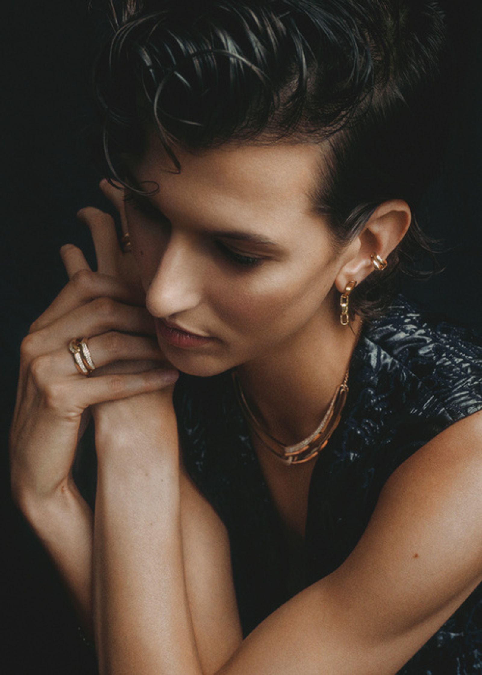 a woman with short hair is posing for a photo