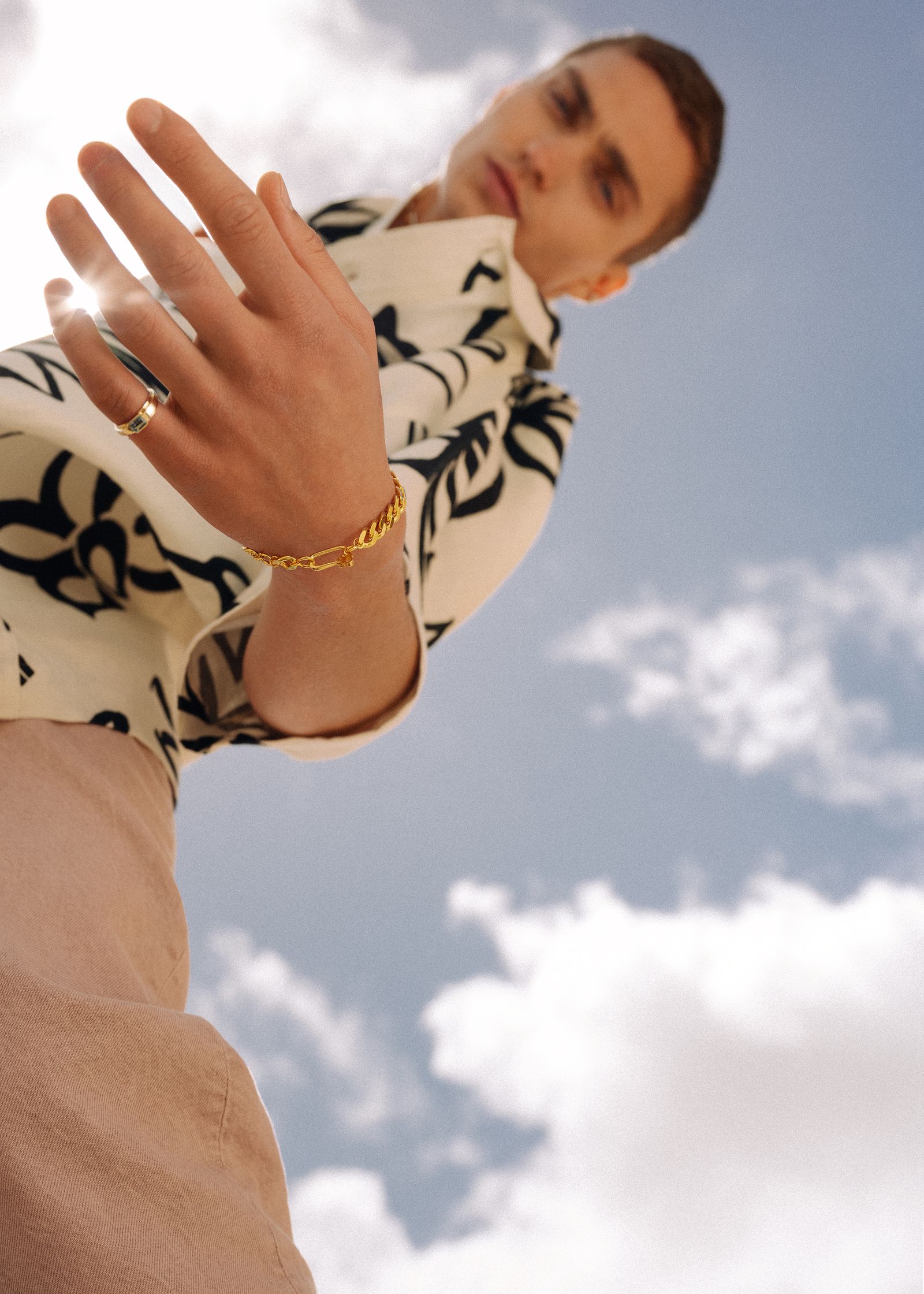 a man on a skateboard with a ring on his finger