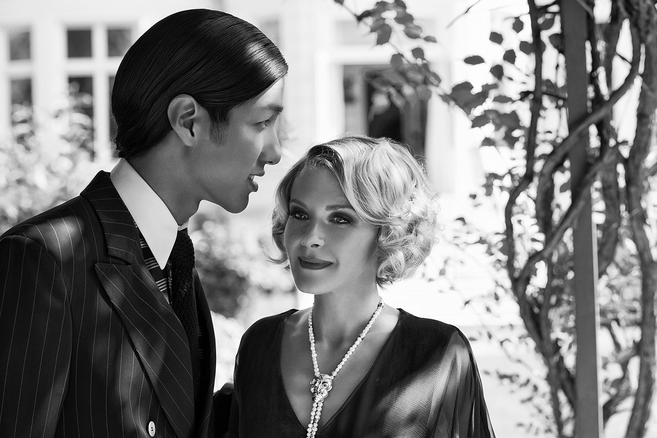 a black and white photo of a man and woman advertising retouch hamburg