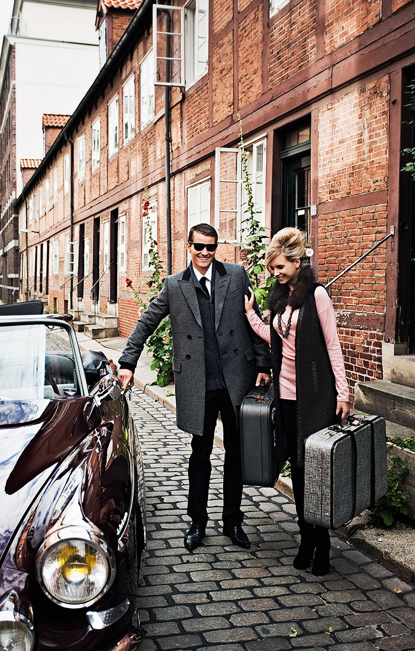 a man and a woman standing next to a car creative retouch and look