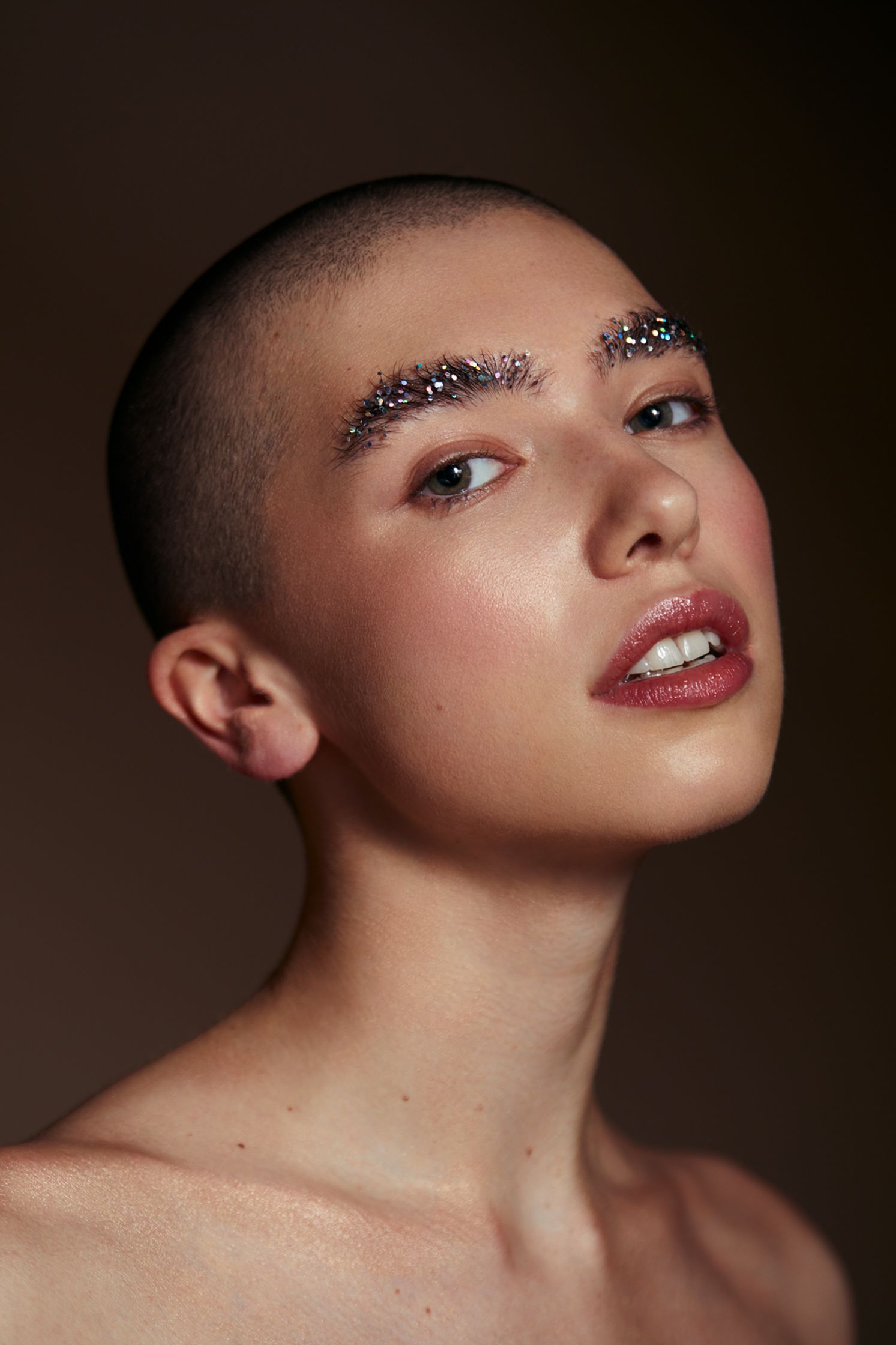 a woman with a shaved head