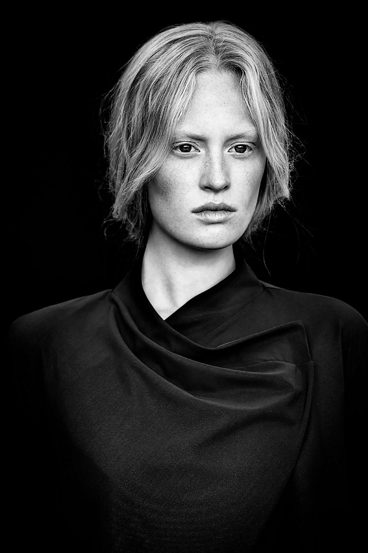 a black and white photo of a woman with blonde hair natural retouch campaign