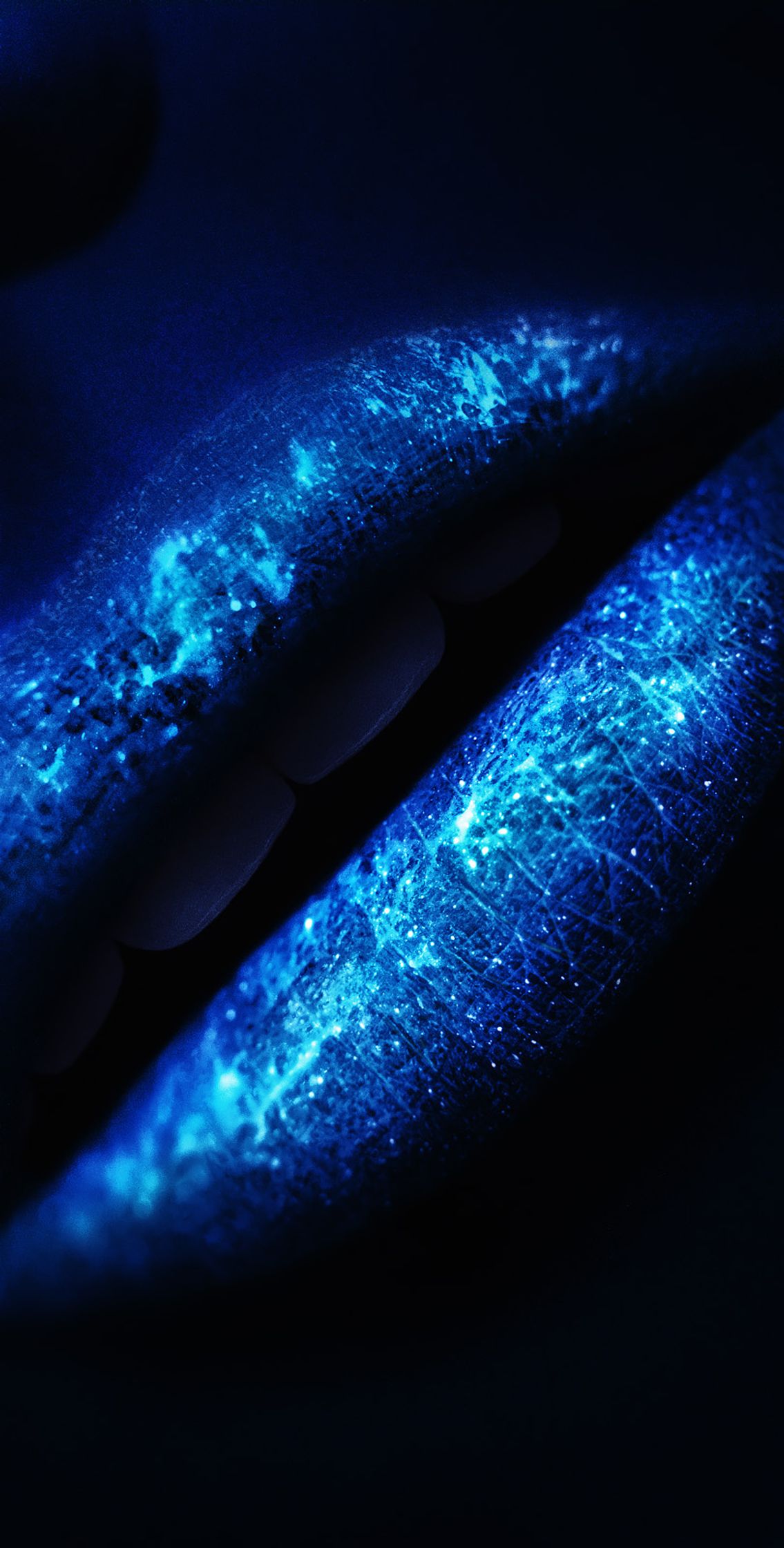 a blue glow on a woman's lips post production