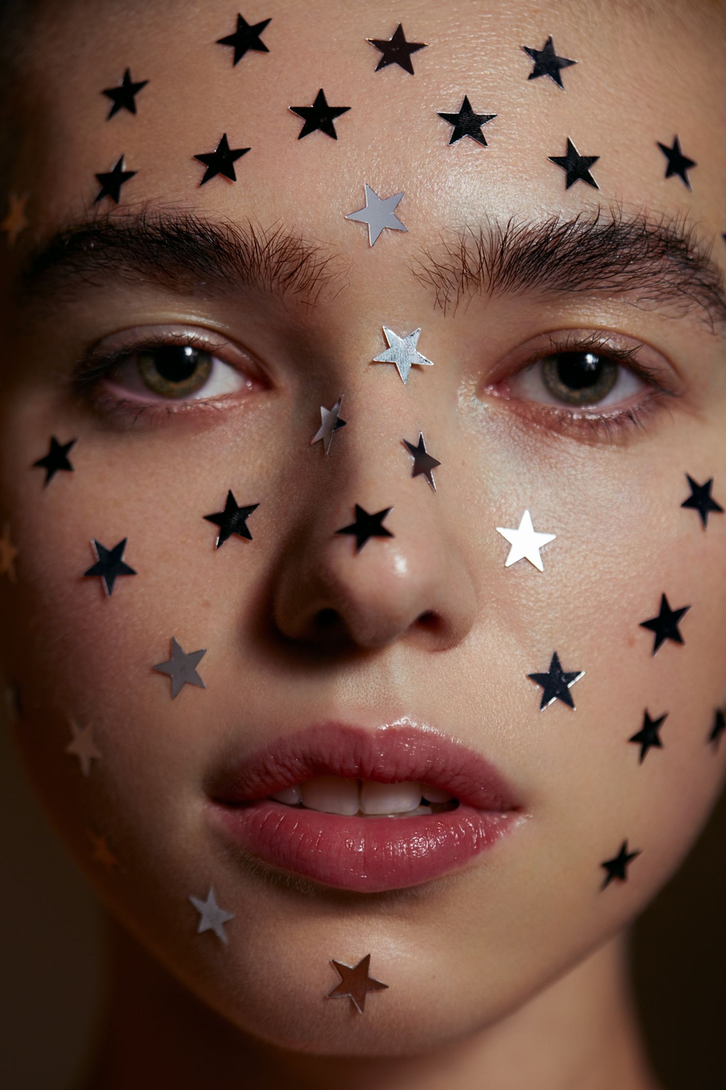 a woman with stars on her face