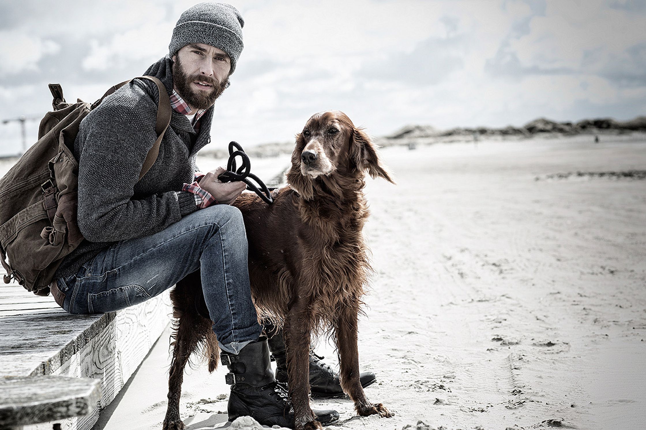 a man with a dog on a beach retouch image campaign