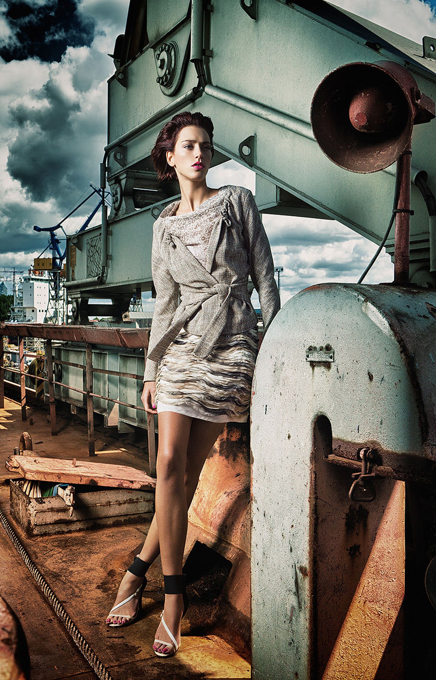 a woman is posing for a picture on a boat fashion image campaign