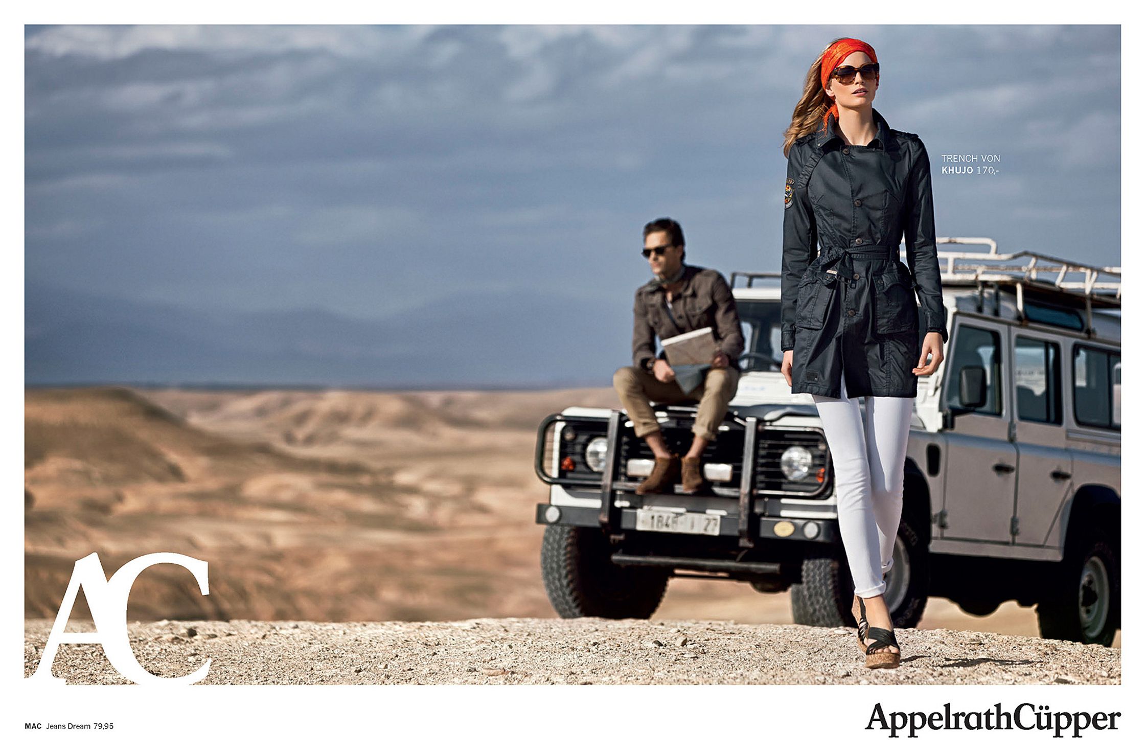 a woman is standing next to a jeep in the desert fashion retouche