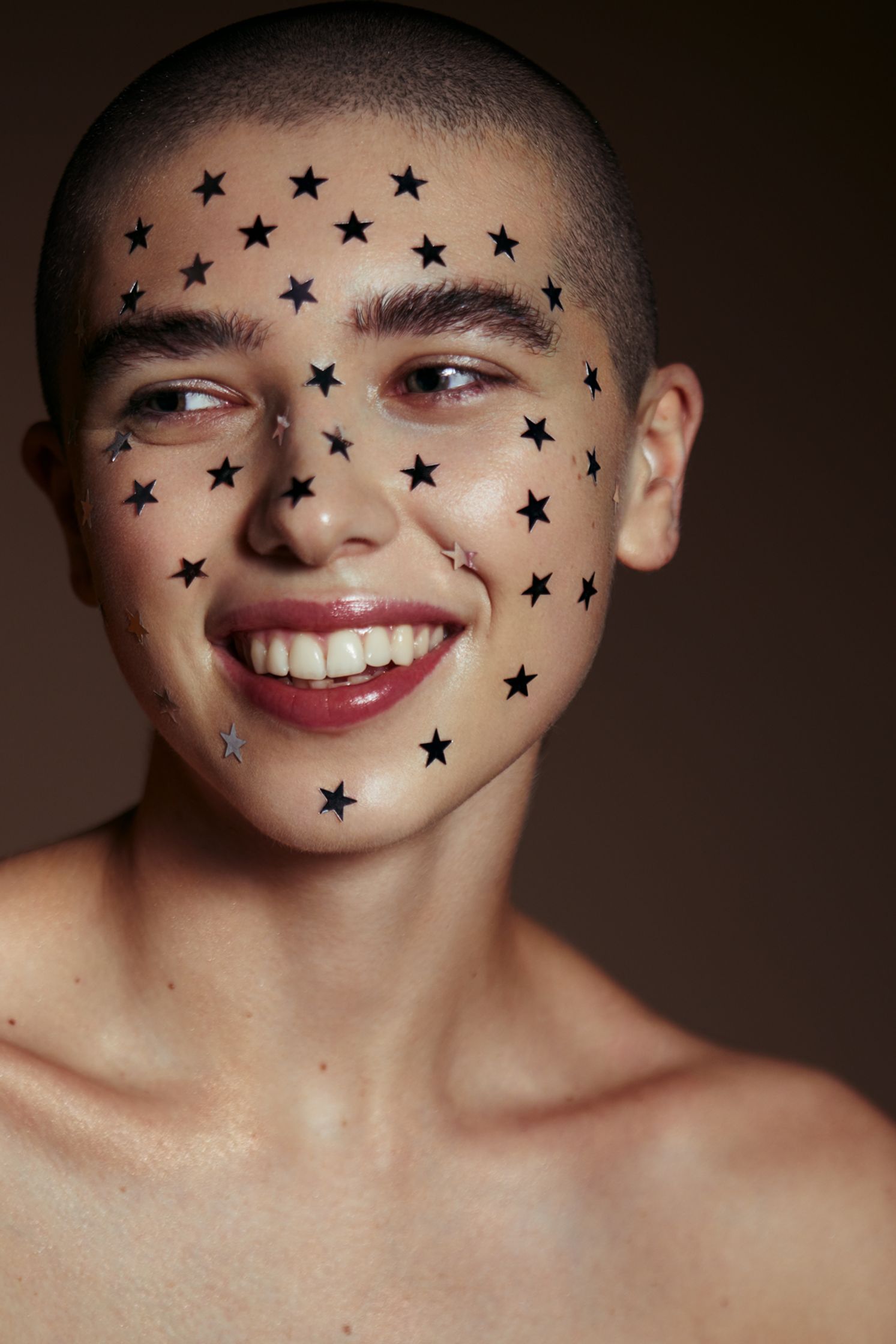 a woman with stars painted on her face