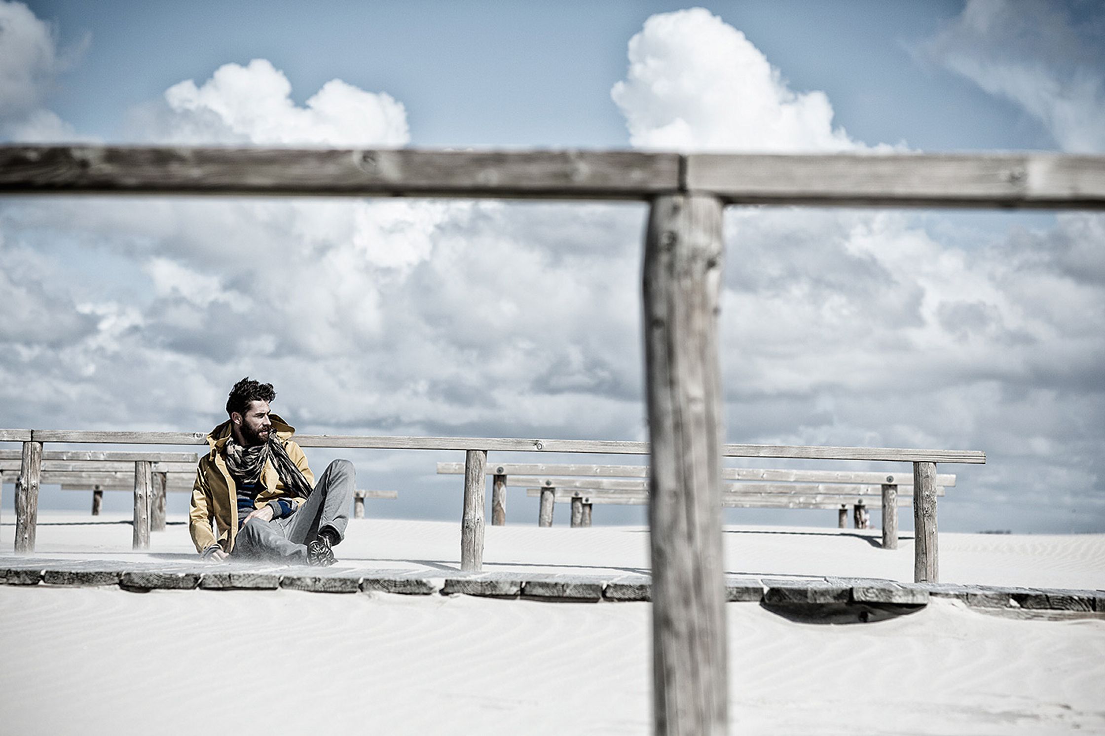 a man on a skateboard on a sand beach post production image campaign