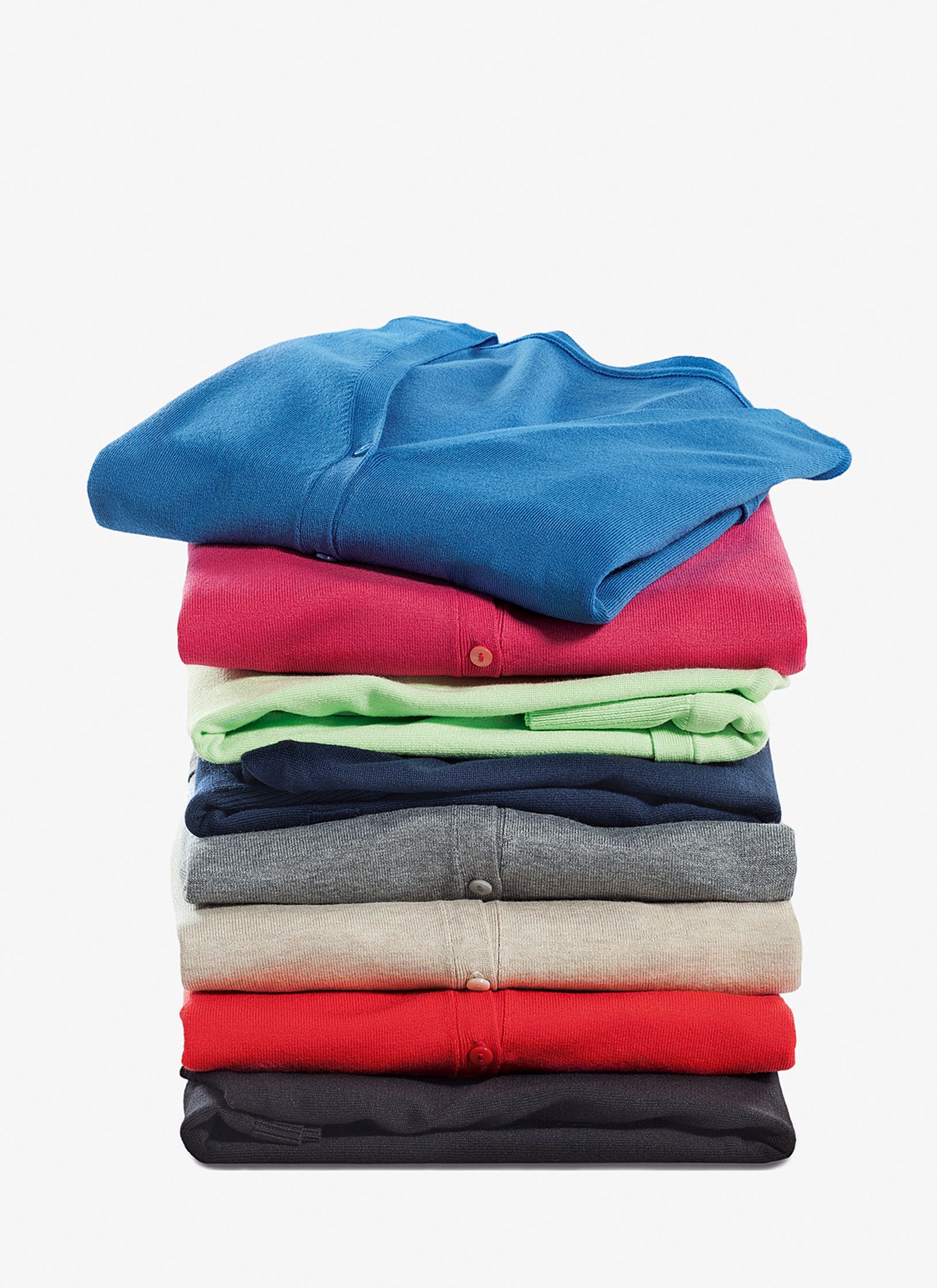 a stack of colorful t - shirts on a white background Post Production Hamburg