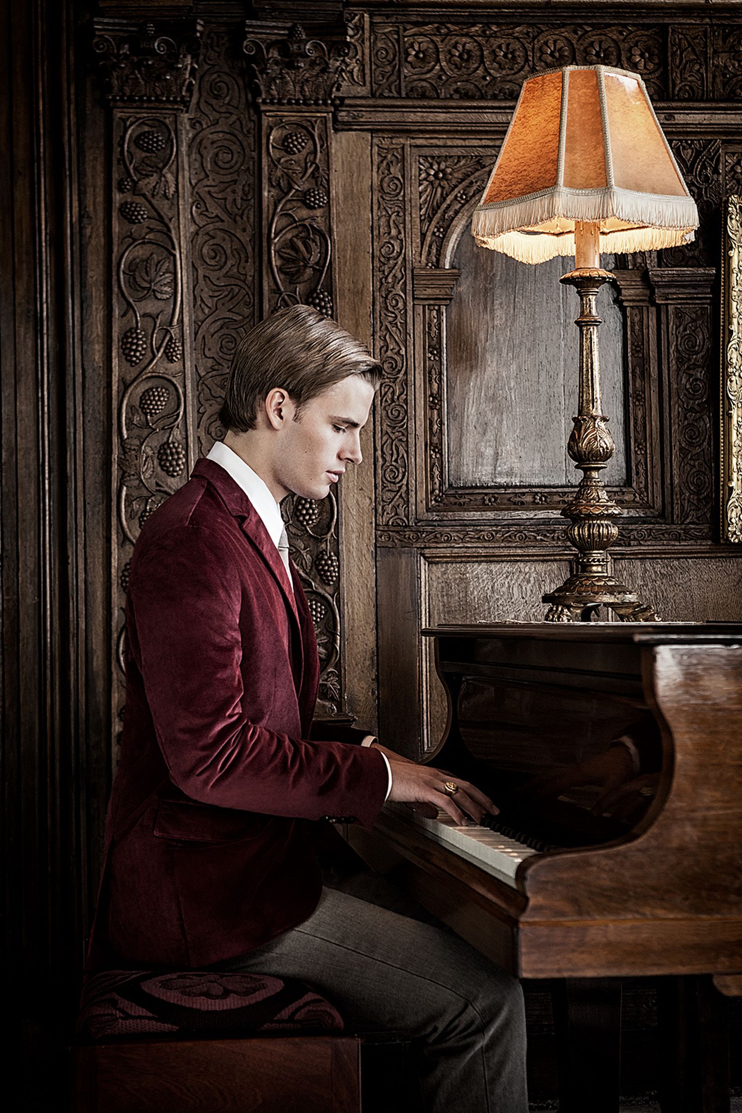 a man sitting at a piano creative post production