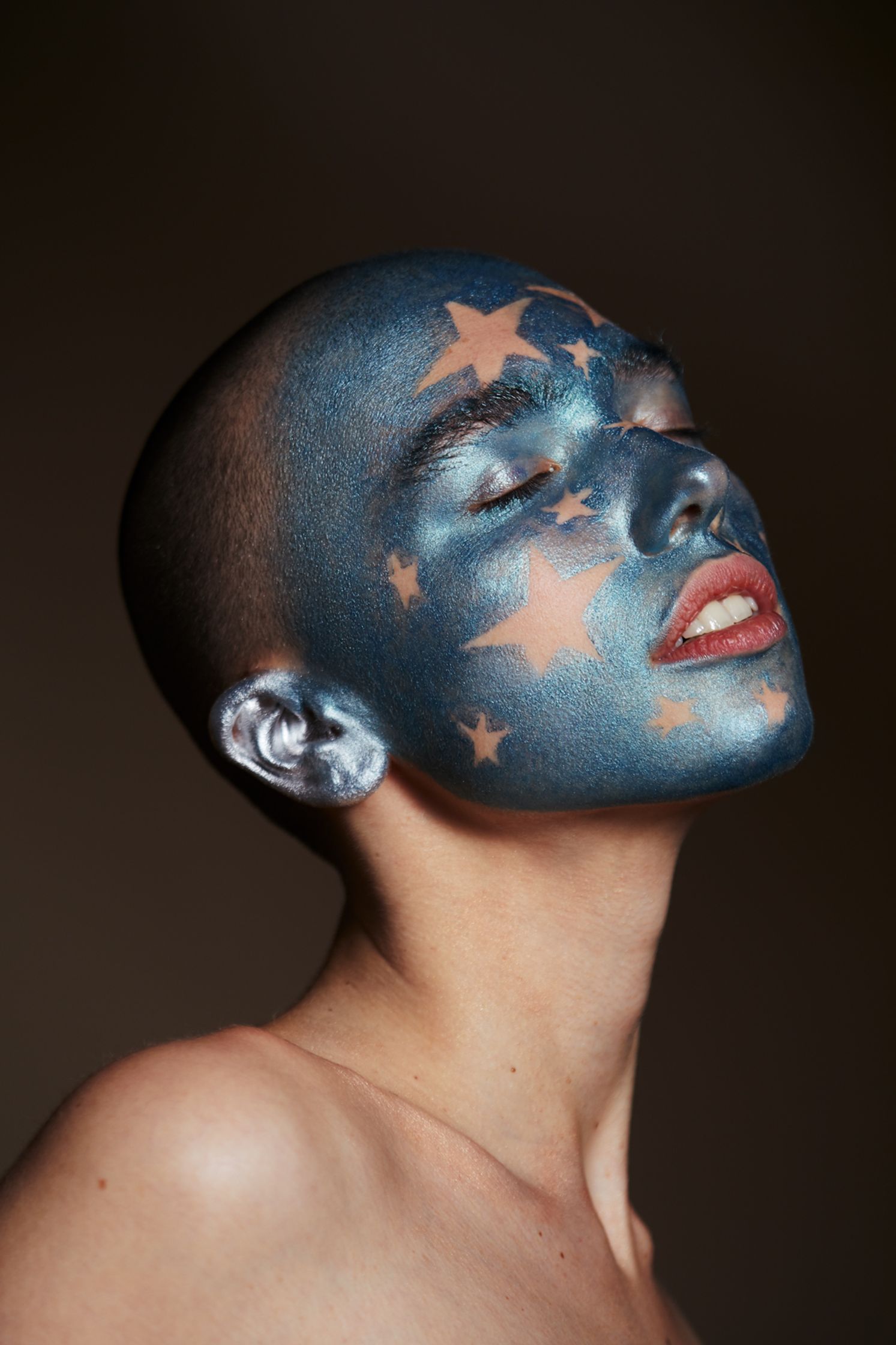 a woman with stars painted on her face