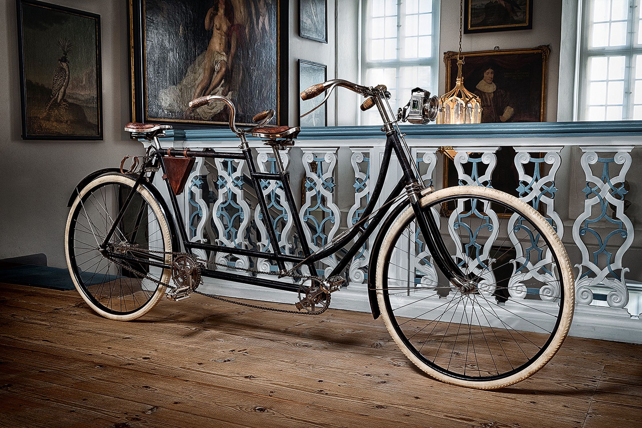 a bicycle parked on a wooden floor in a room product Post Production