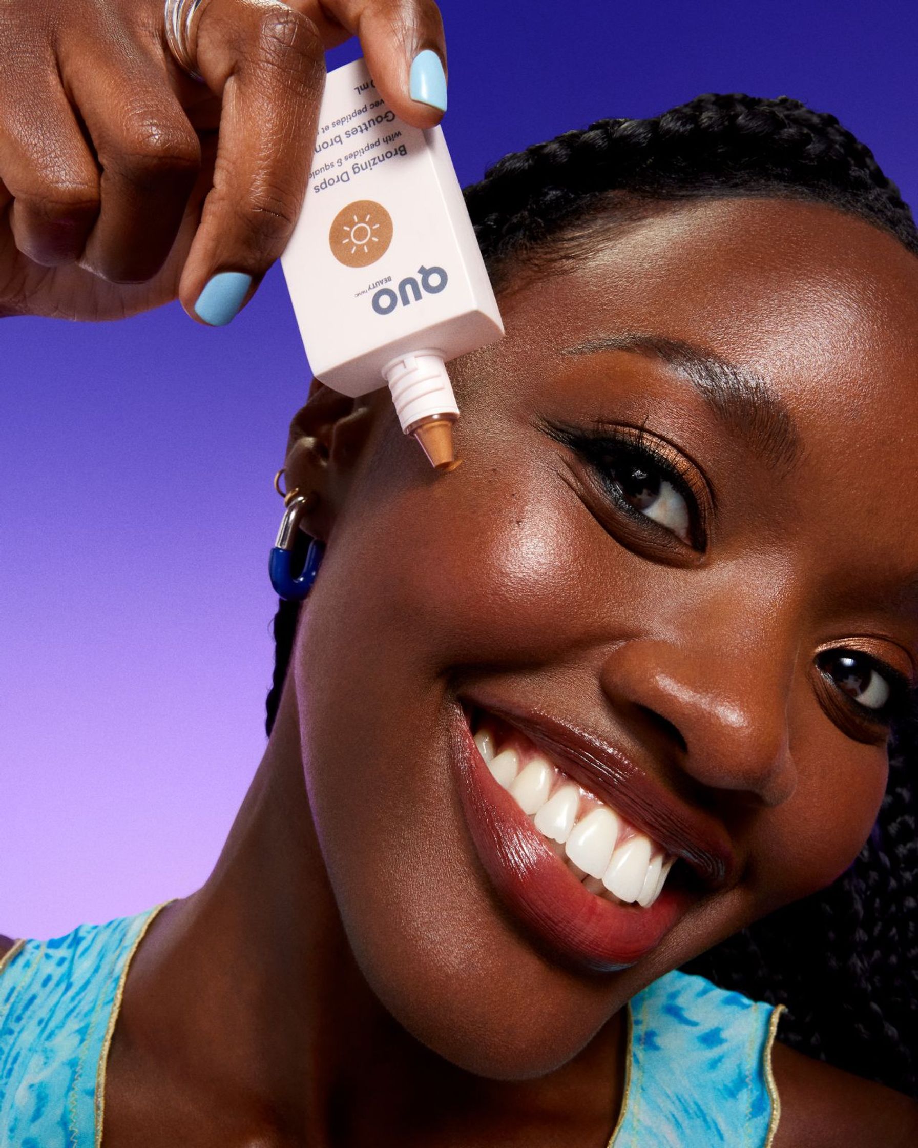 a woman is holding a bottle of sunscreen