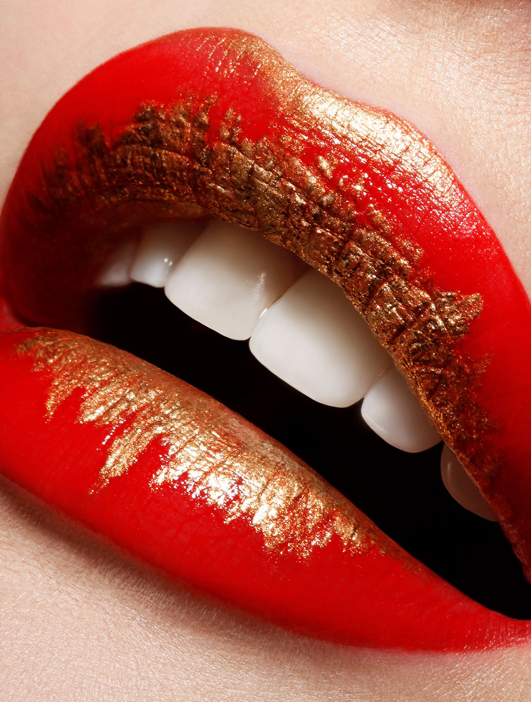 a close up of a woman's red and gold lips  glamour retouch