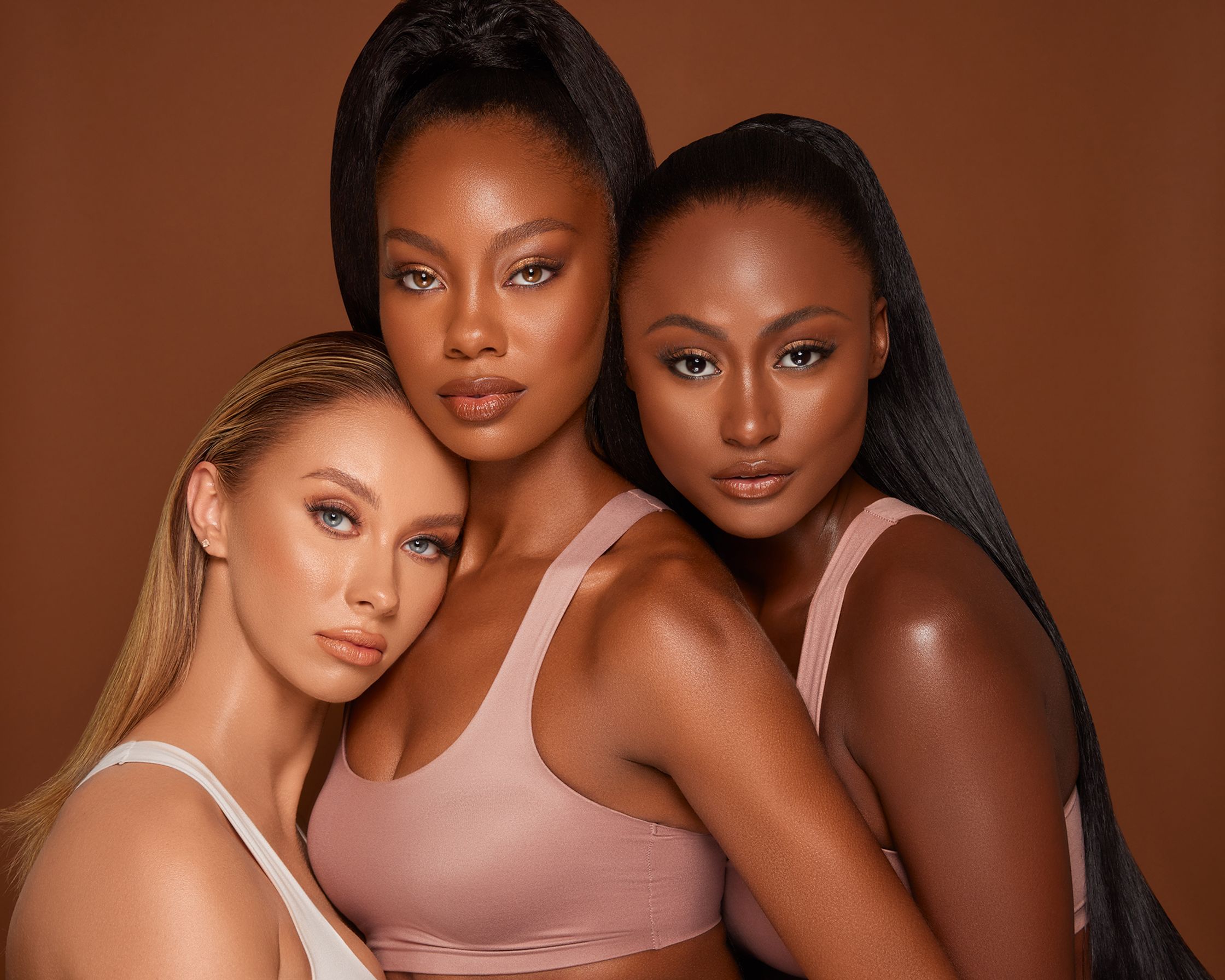 three beautiful women posing for a photo