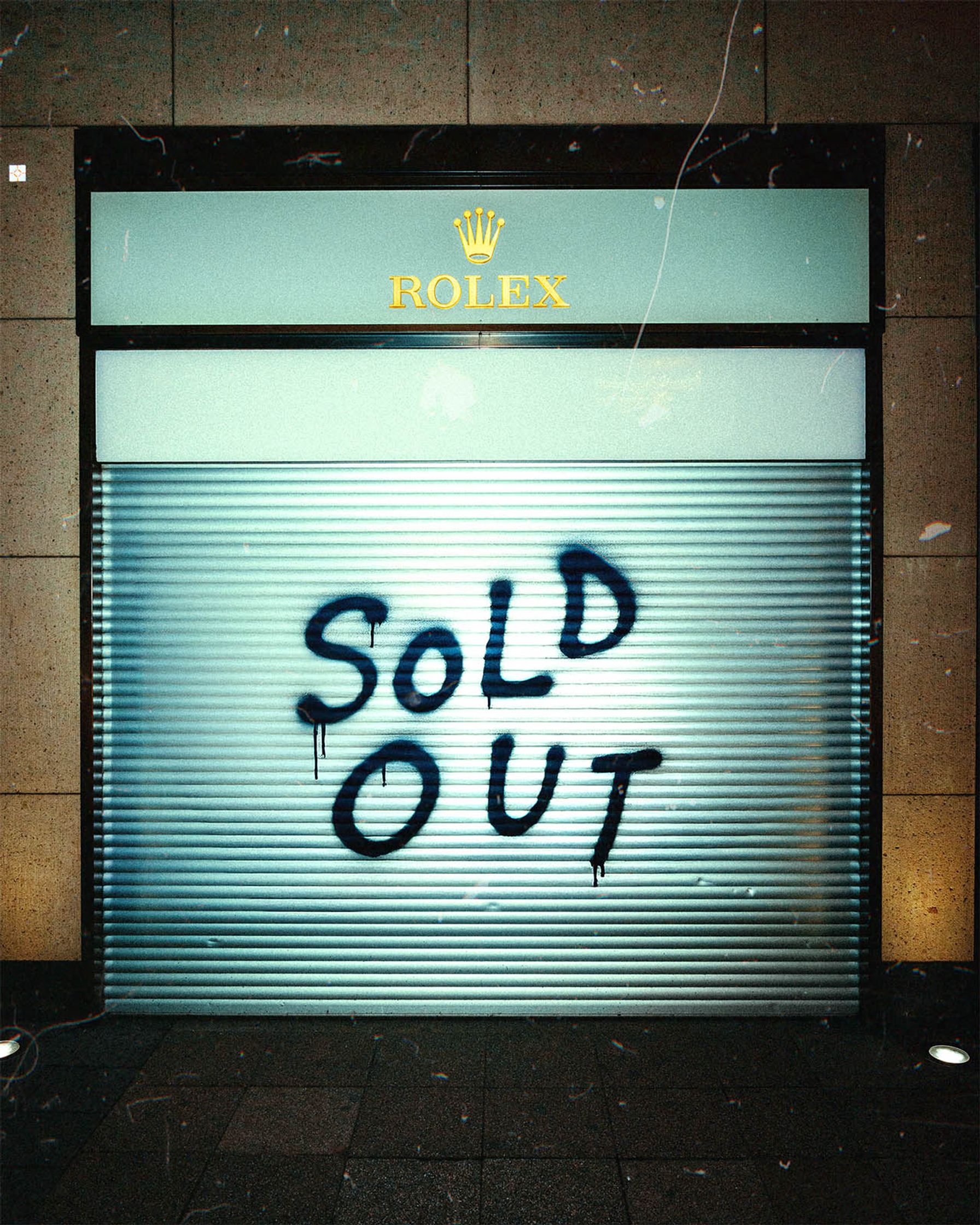 a rolex Boutique garage door with the words sold out on it