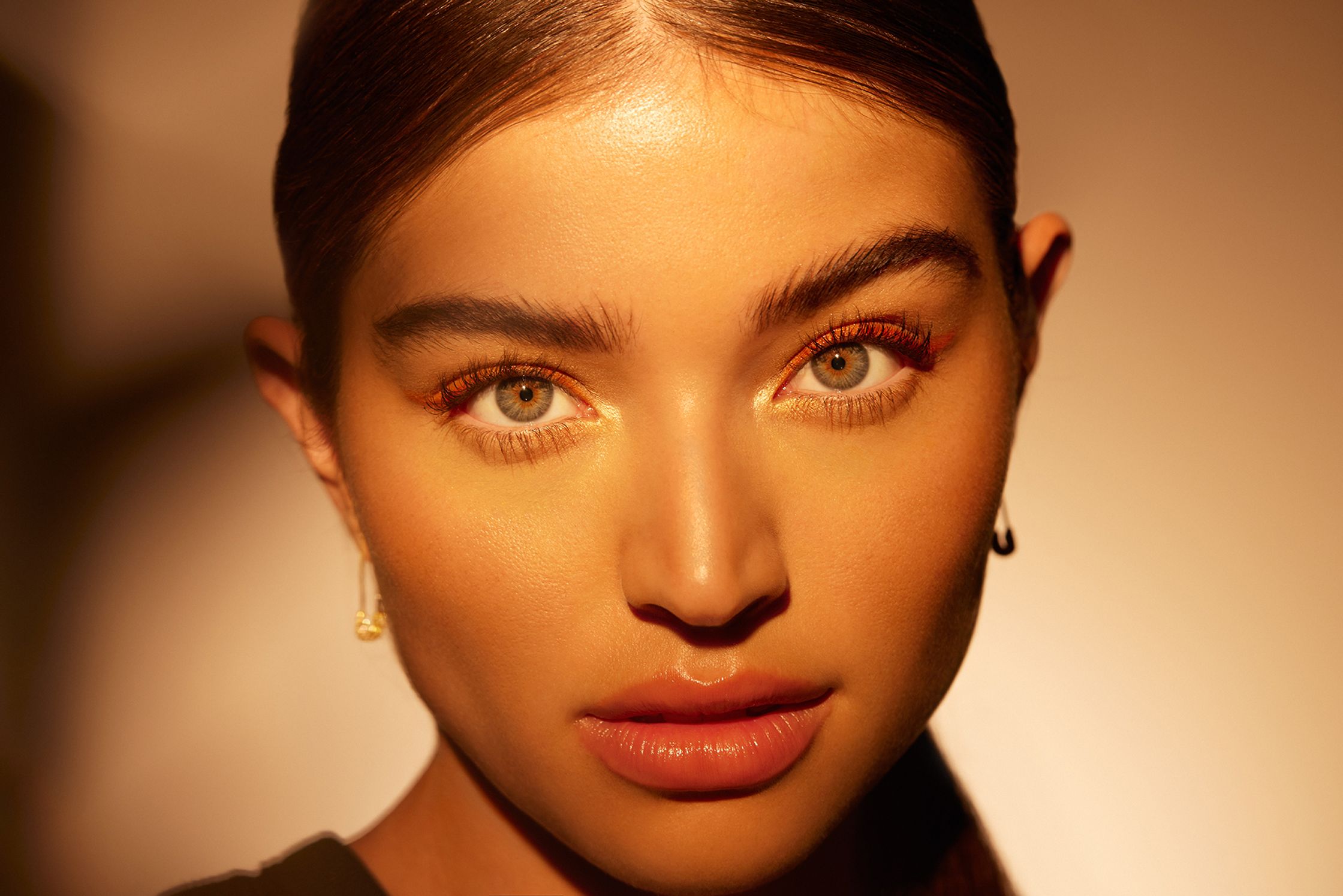 a woman is posing with her eyes wide open