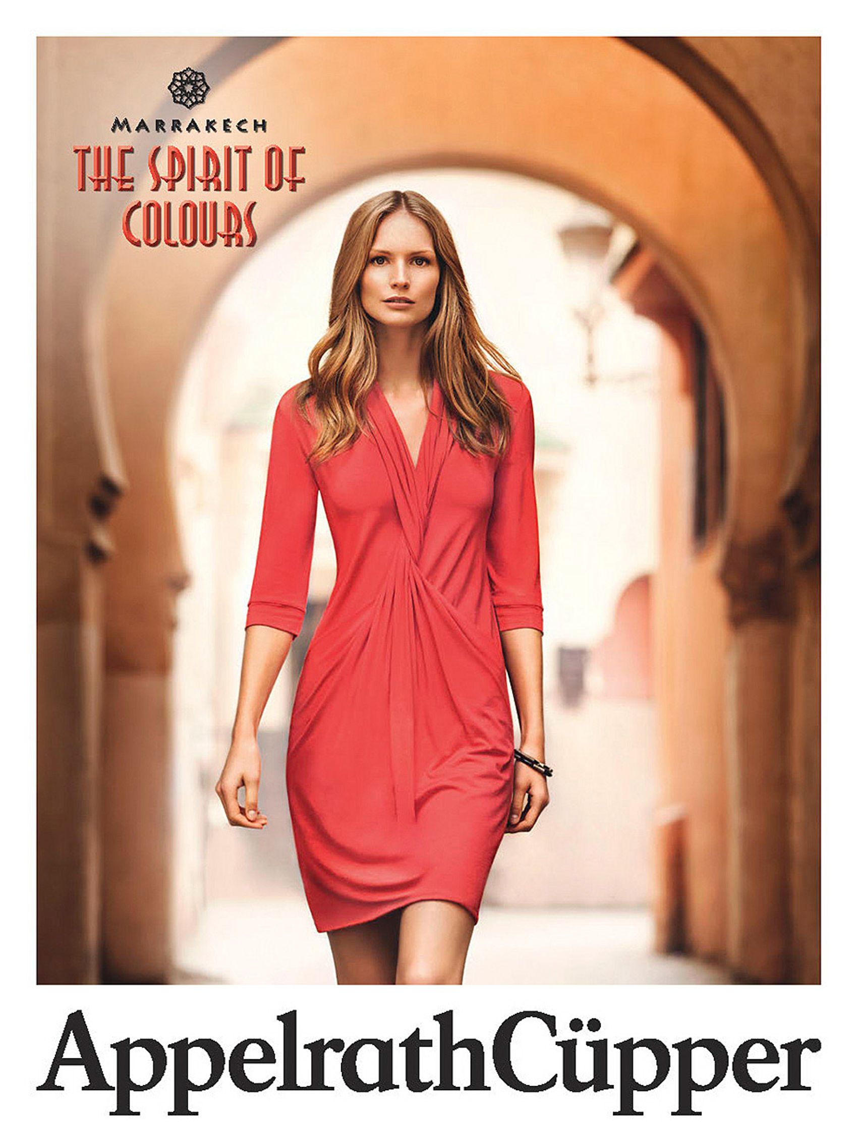 a woman in a red dress walks through an archway fashion Post Production