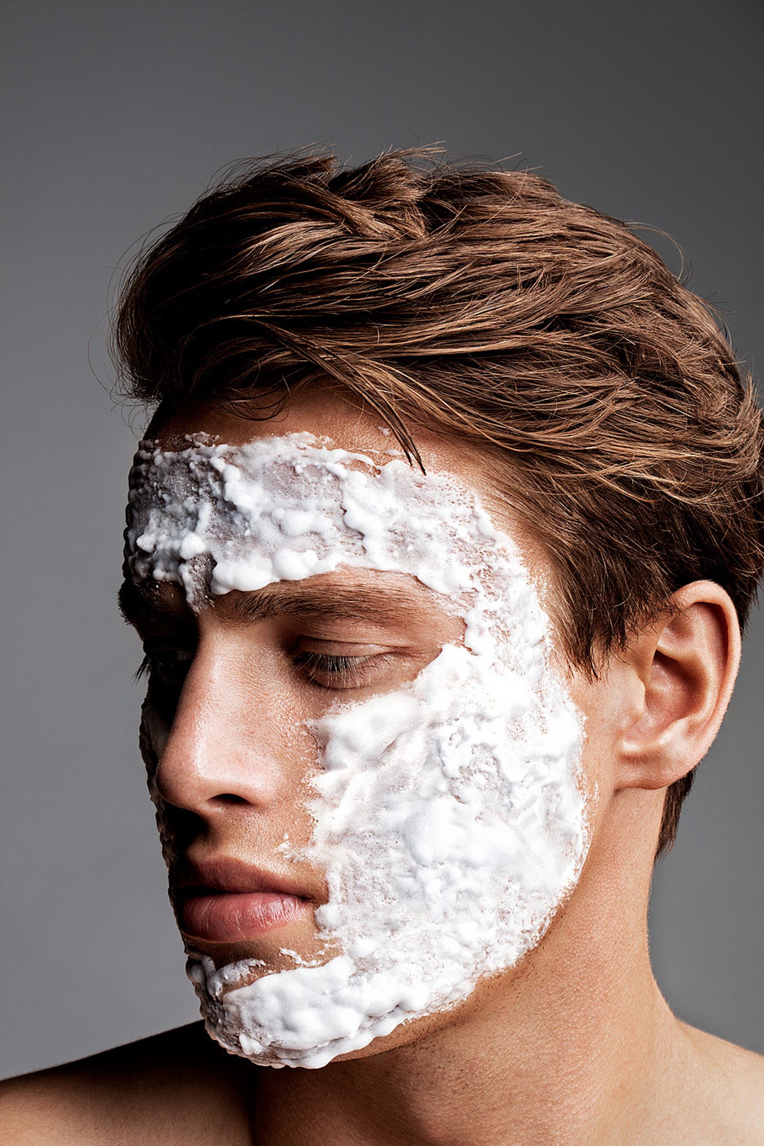 a man with white shaving cream on his face men cosmetic post production hamburg