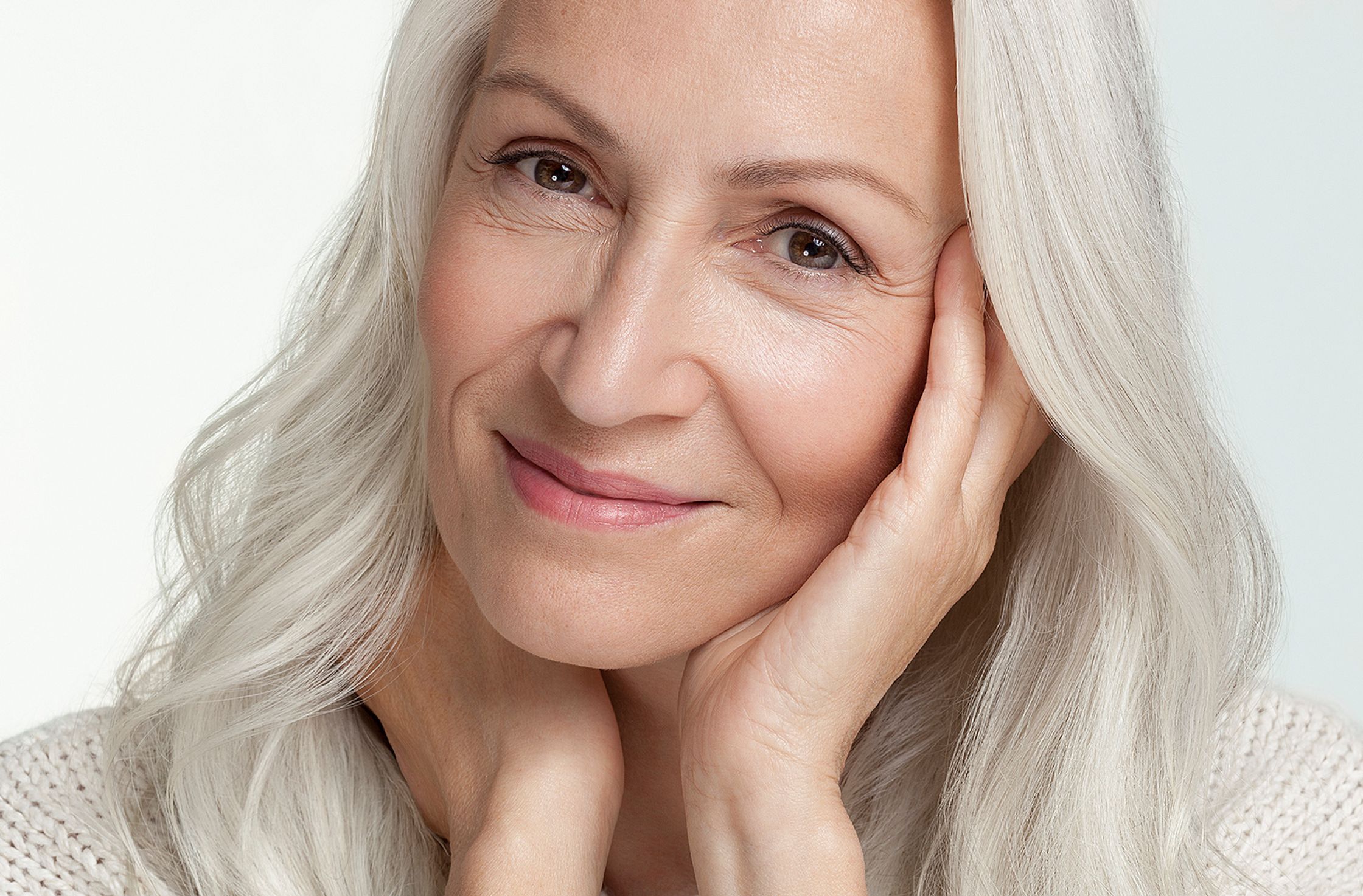 a woman with long white hair is posing for a photo best ager post production