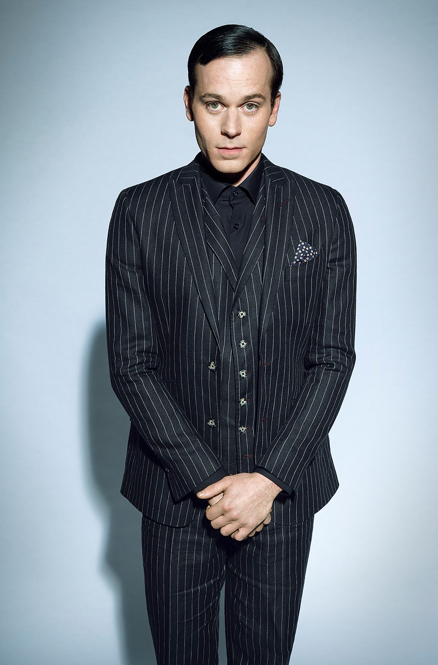 florian bartolomaei in a pinstripe suit posing for a photo
retouche by glamtouch