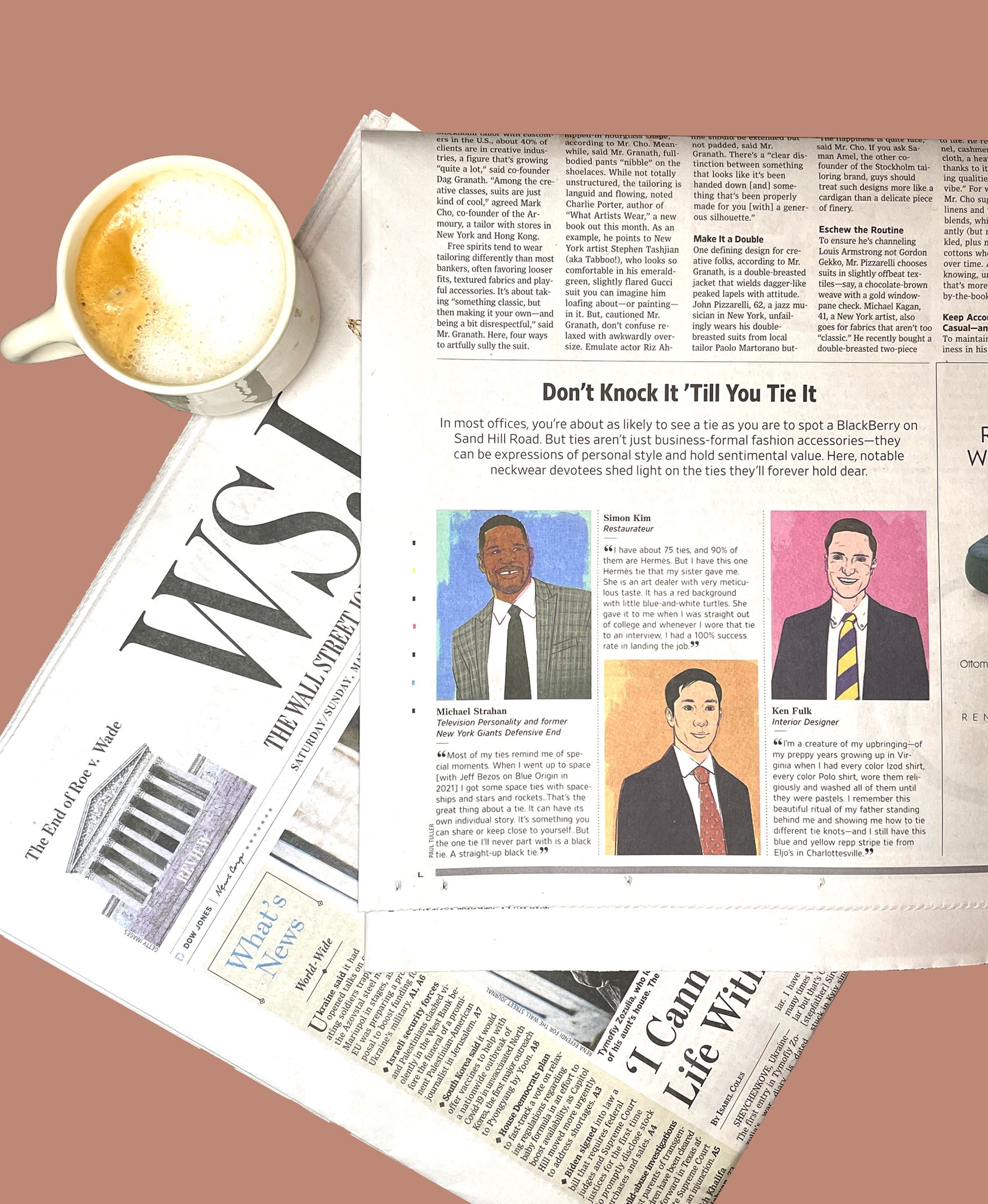 The Wall Street Journal newspaper with a cup of coffee and a illustrated portraits by Paul Tuller