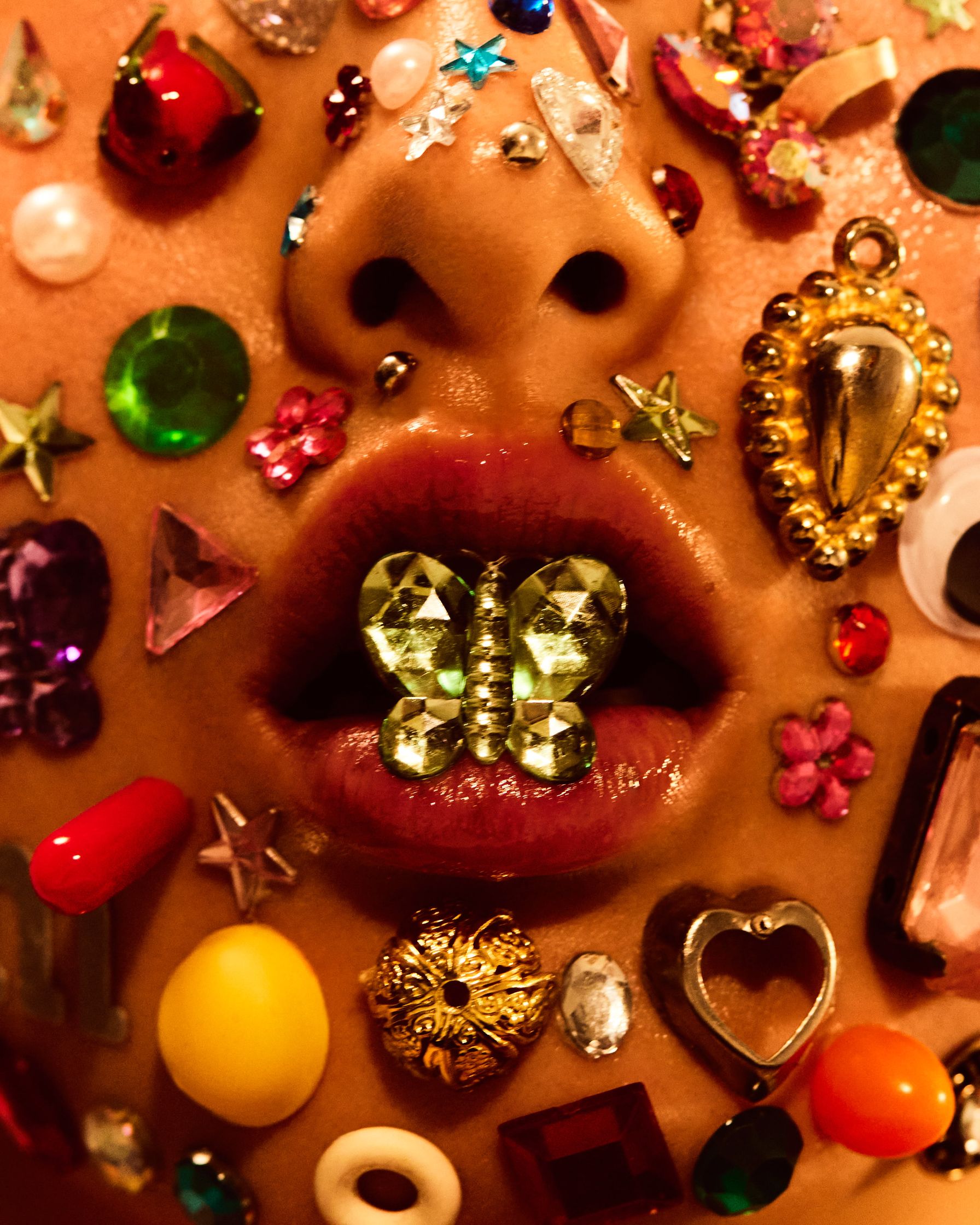 a woman's face covered with a lot of jewels