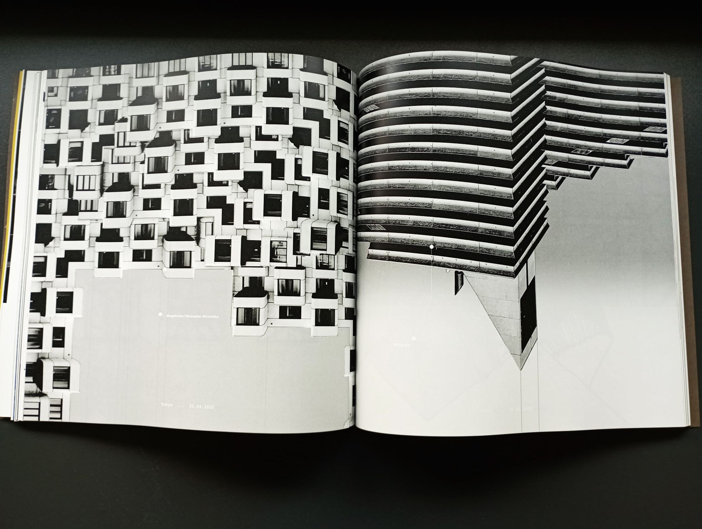 an open book with a black and white image of a building