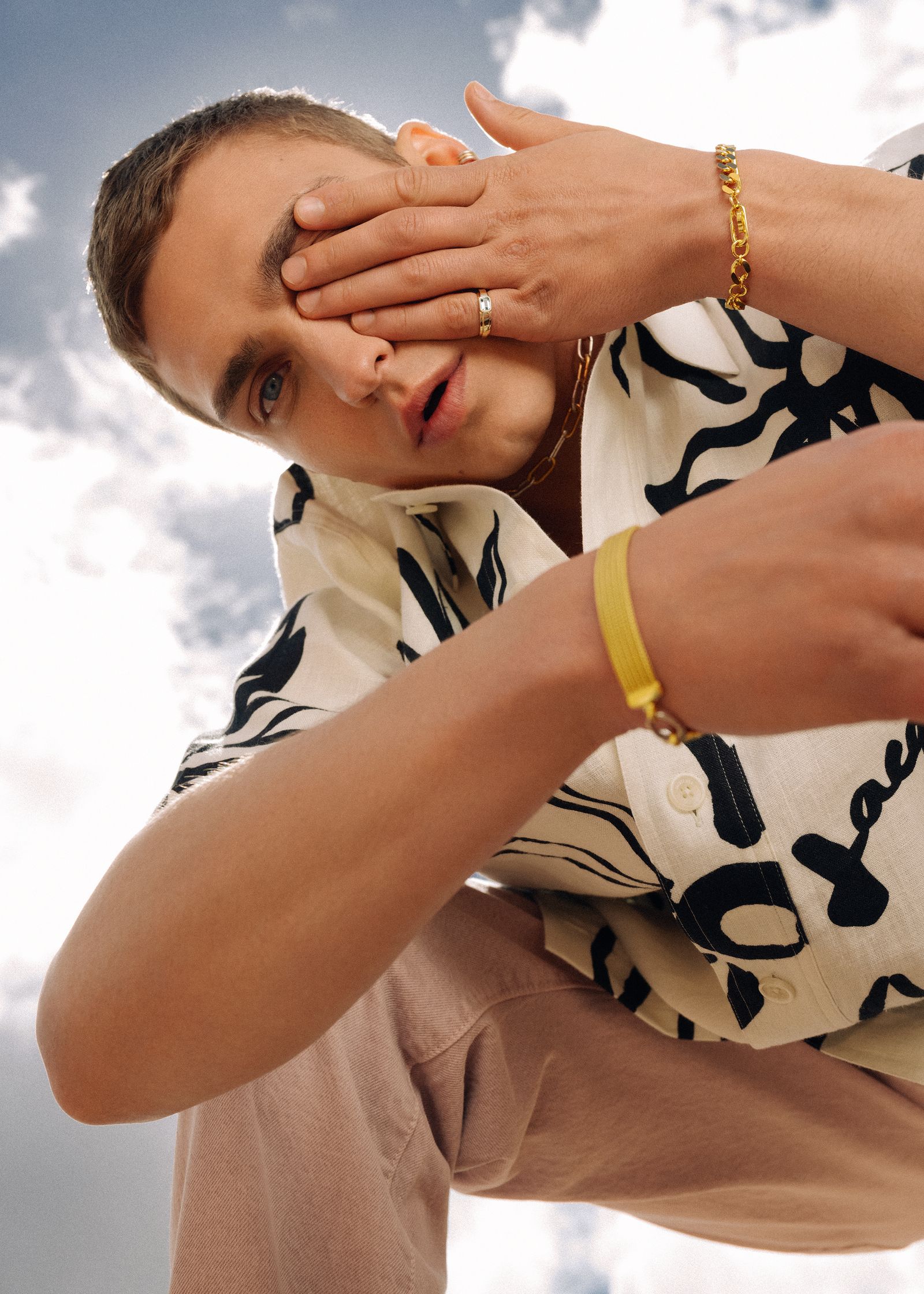 a man wearing a shirt with a pattern on it