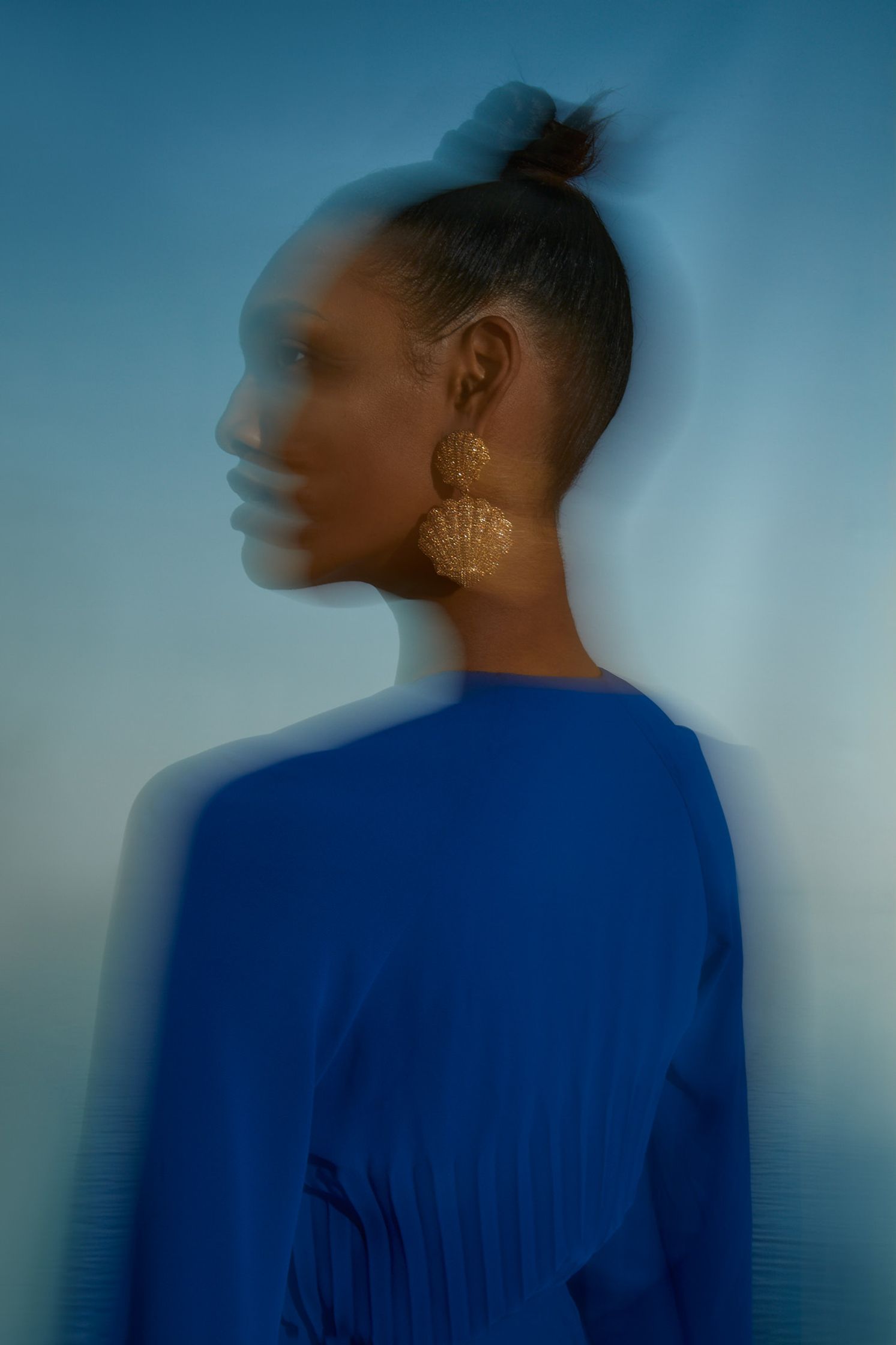 an image of a woman in a blue dress