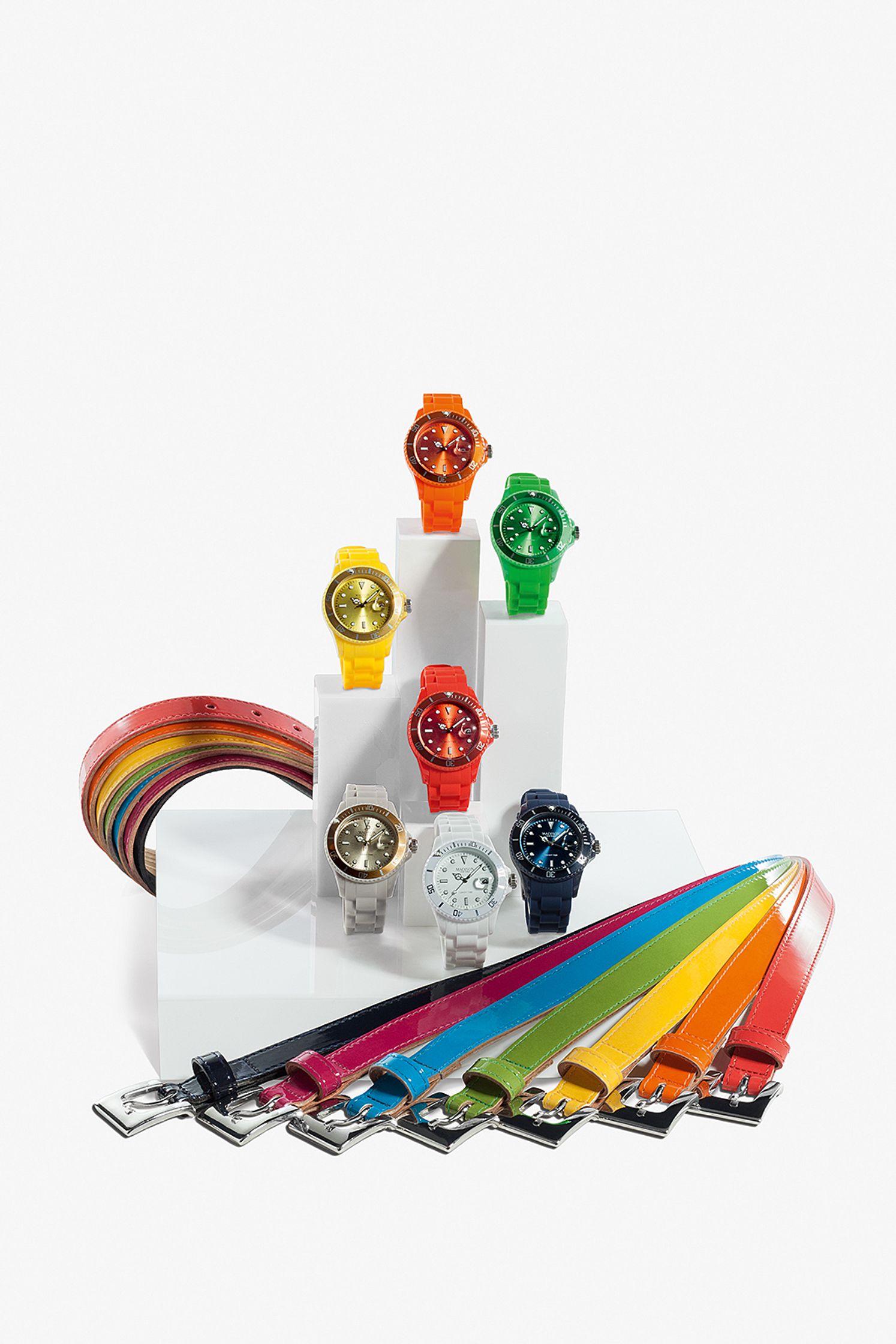 a group of watches with colorful straps on a white background Post Production Hamburg