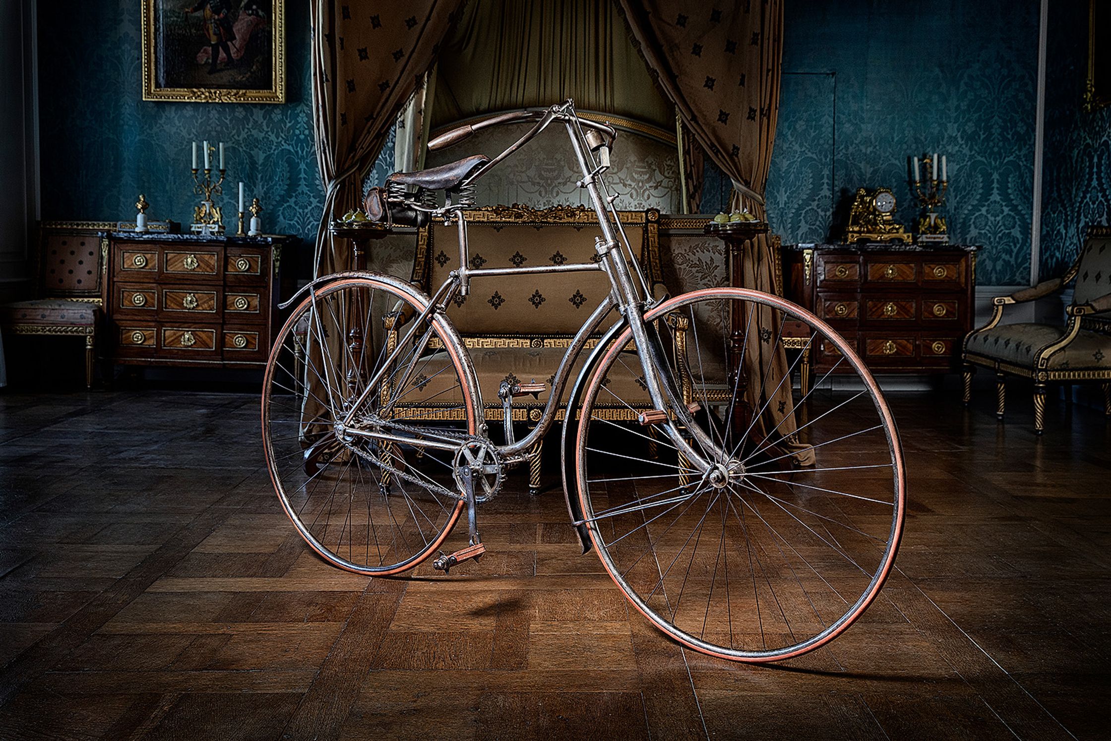 a bicycle sitting on a wooden floor in a room product Post Production